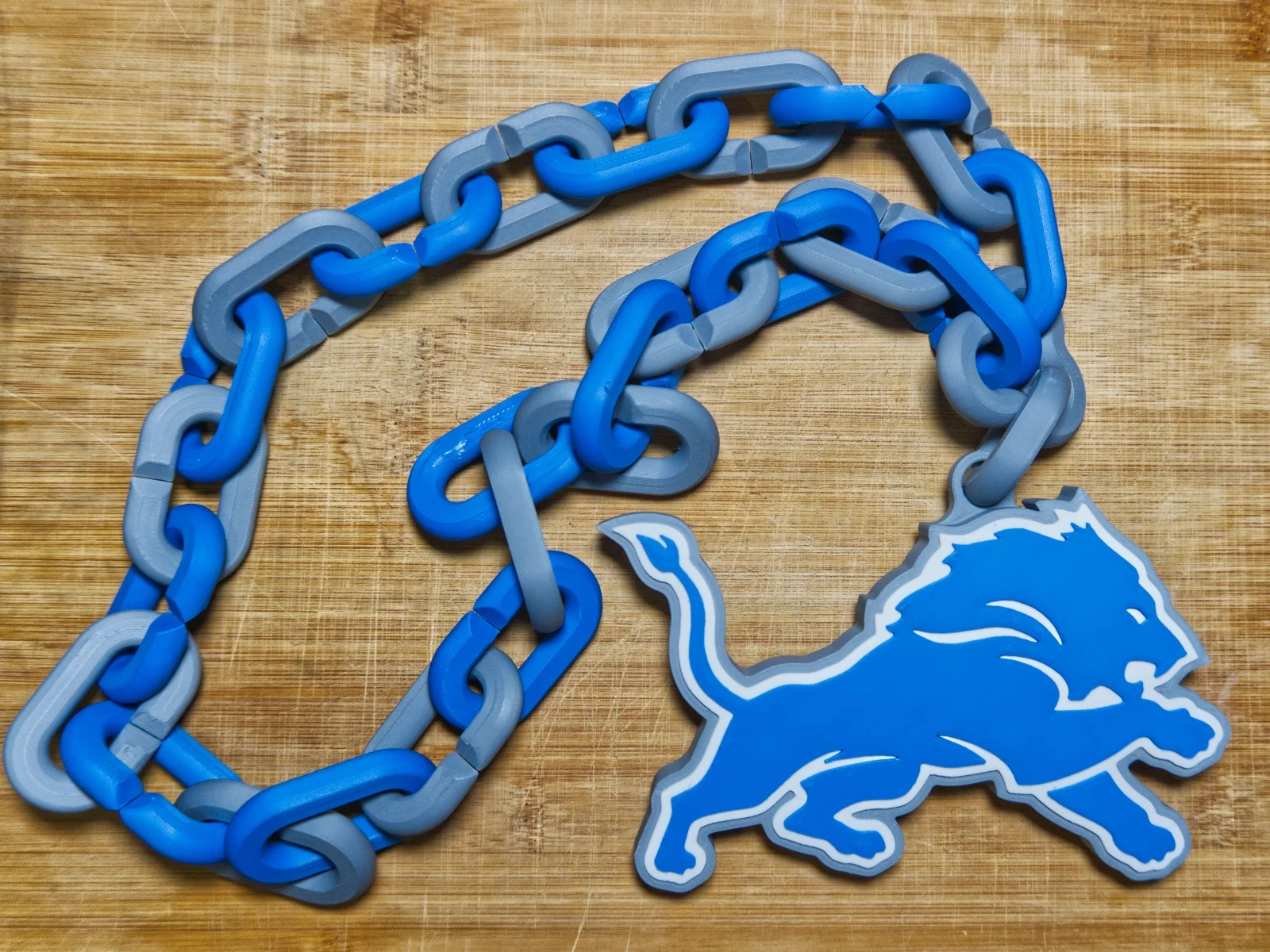 detroit-lions-swag-rally-chain-blue-gray-pendant.webp