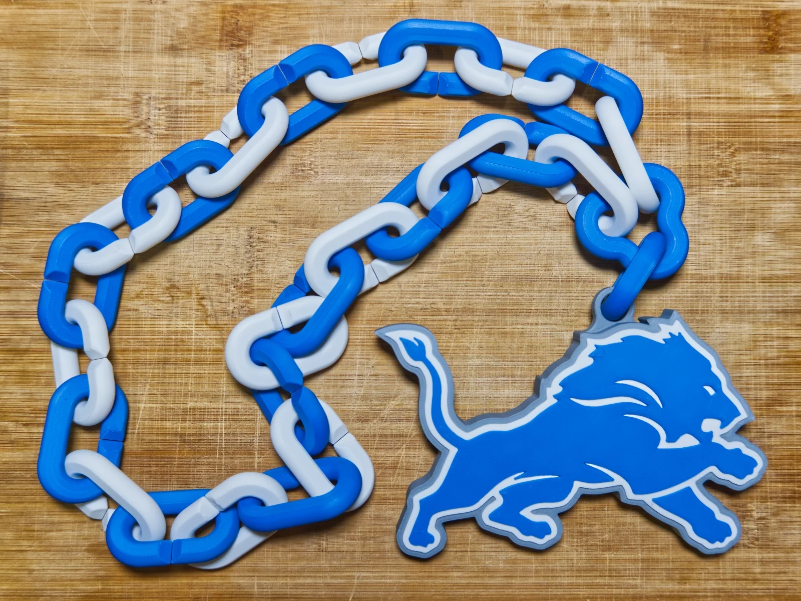 detroit-lions-swag-rally-chain-blue-white-pendant.webp