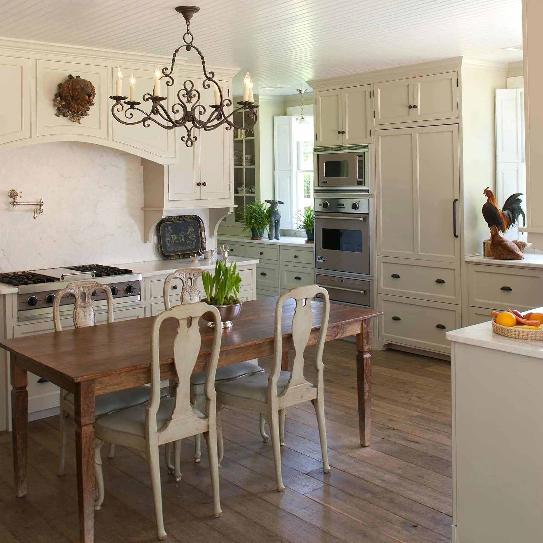 bright-farmhouse-kitchen-with-antique-table-custom-cabinetry.jpg