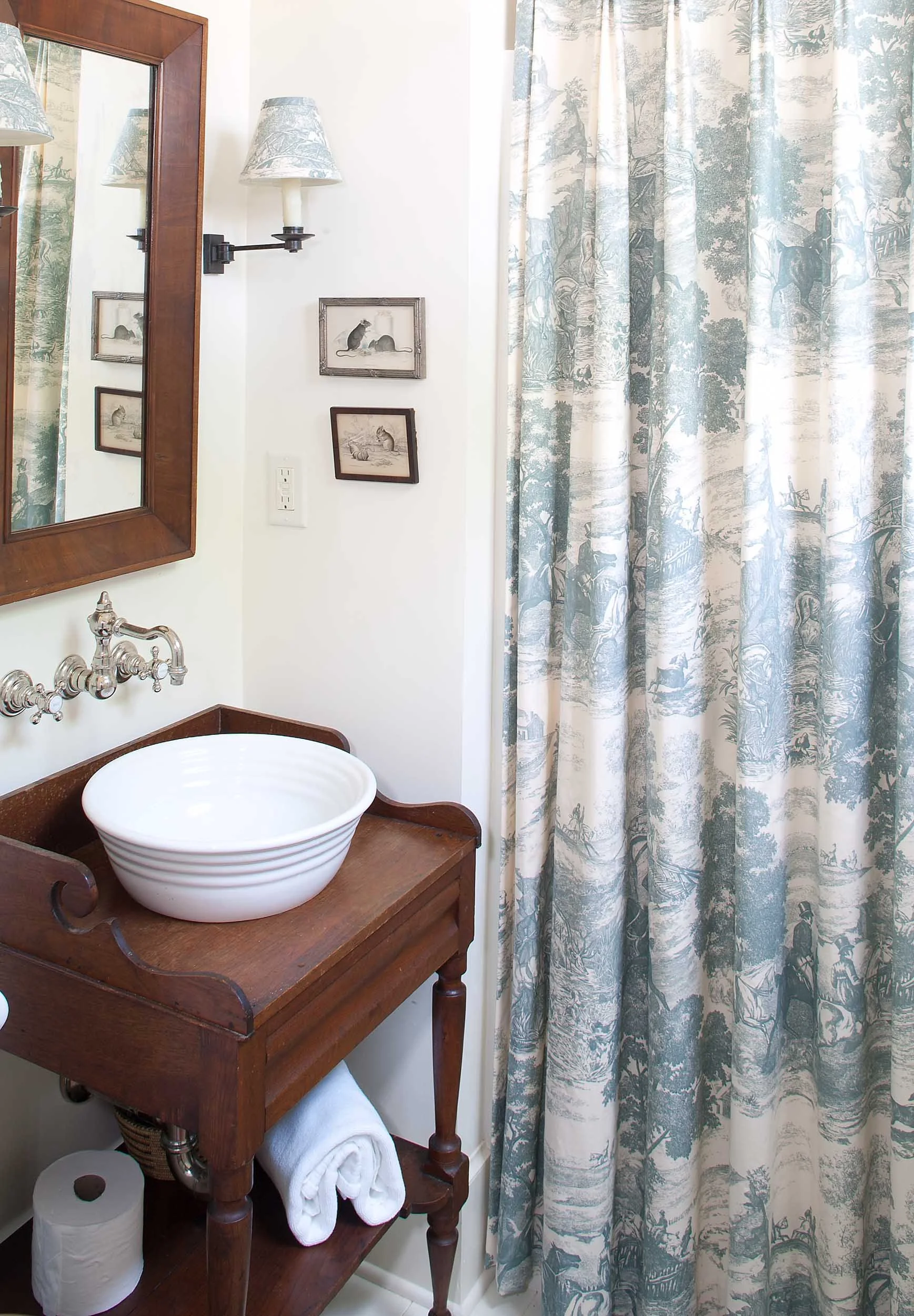 guest-bathroom-with-antique-washbasin-blue-patterned-curtain.jpg