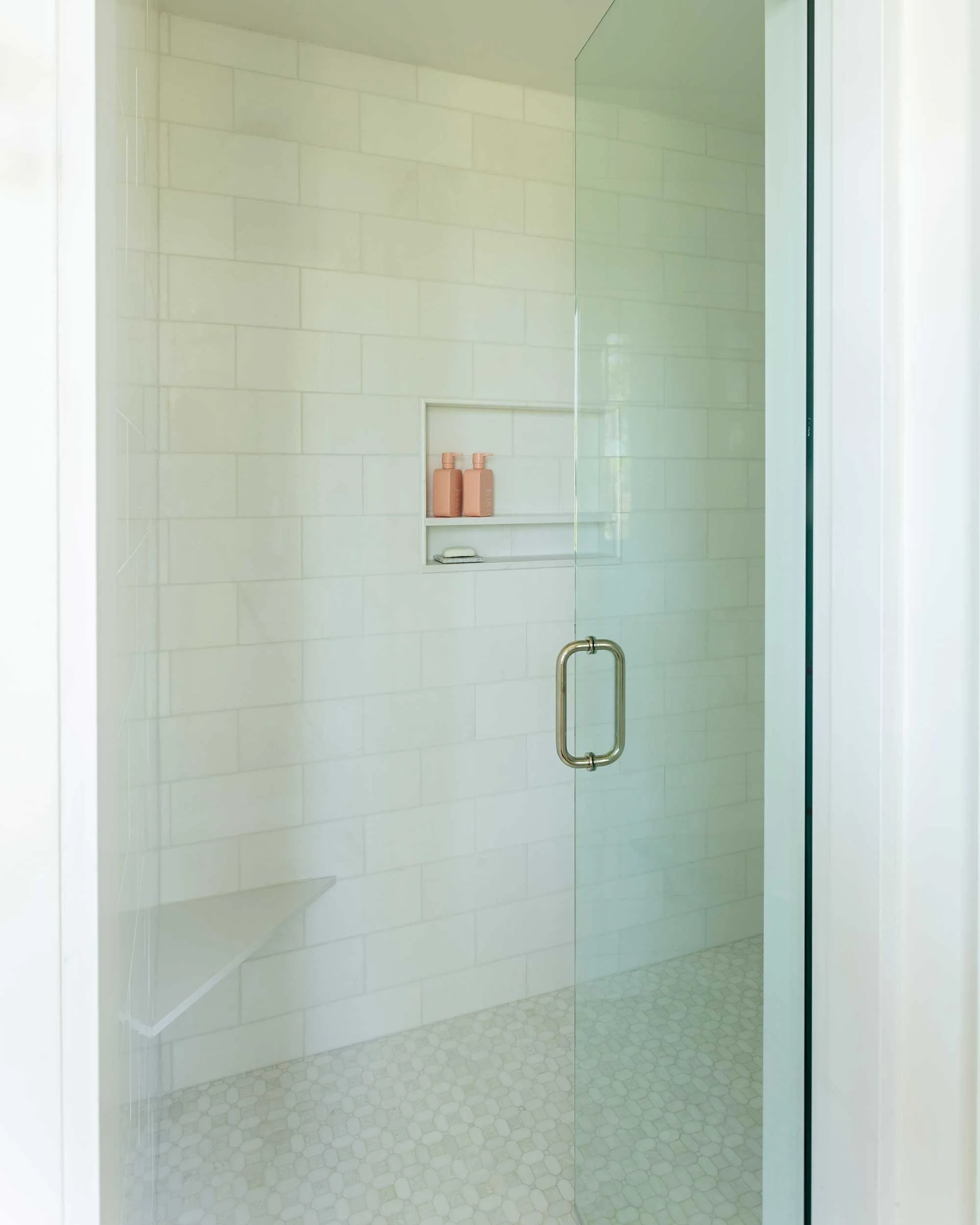 white-marble-guest-shower-with-frameless-door.jpg