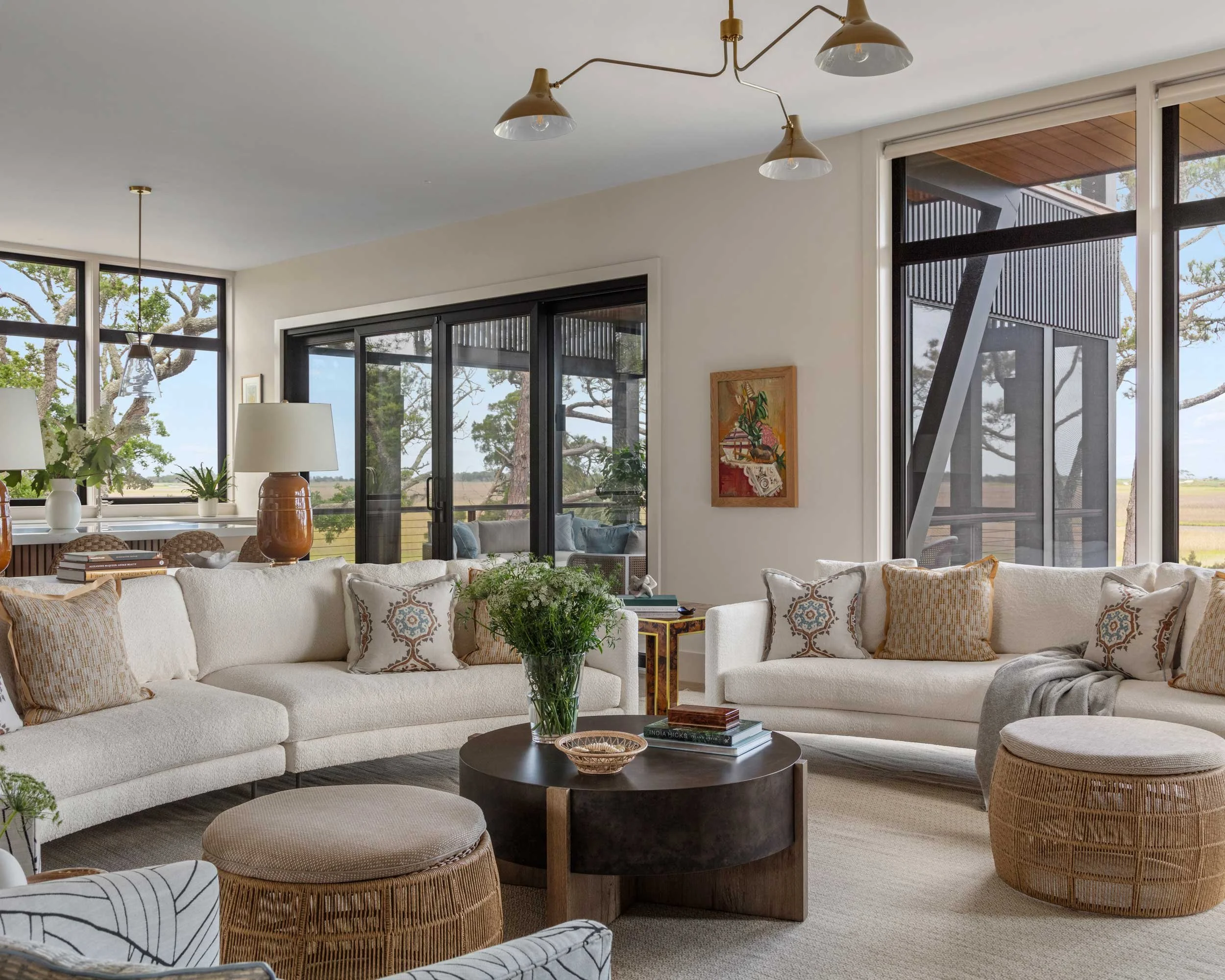 pair-thayer-coggin-curved-sofas-provide-ample-seating-in-marsh-view-living-room.jpg