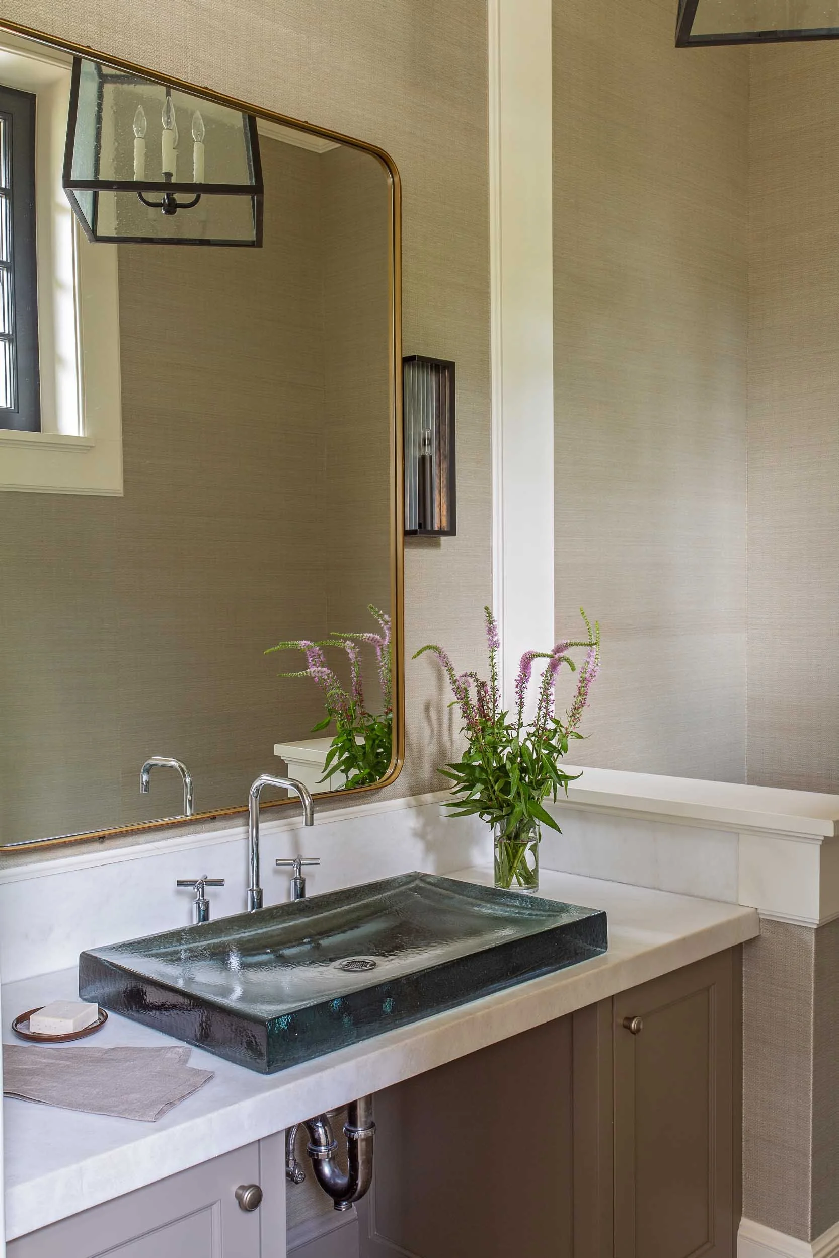 powder-room-with-grass-cloth-waalcovering-and-kohler-sink-and-faucet.jpg