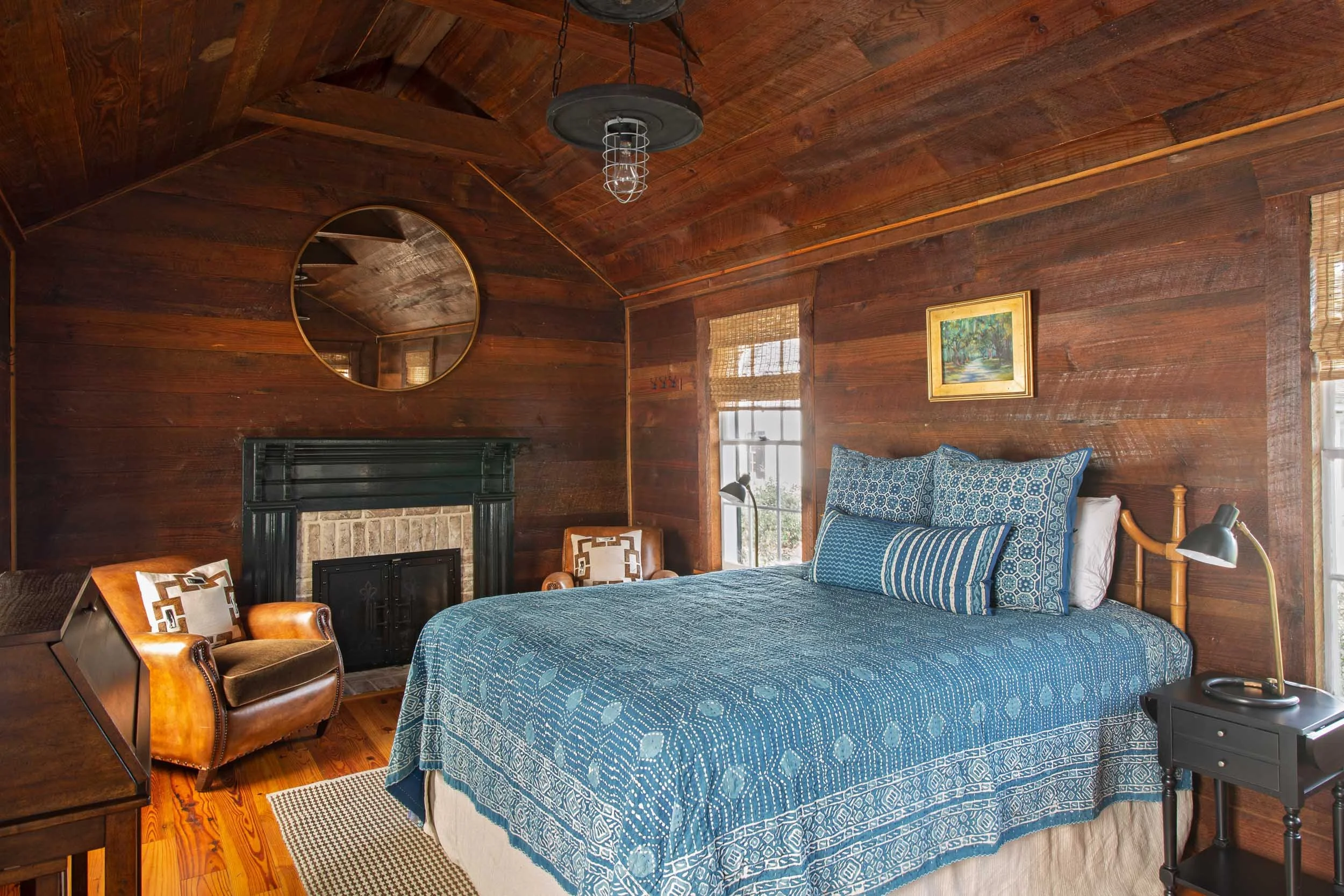 guest-bedroom-cypress-siding-brick-hearth-fireplace.jpg