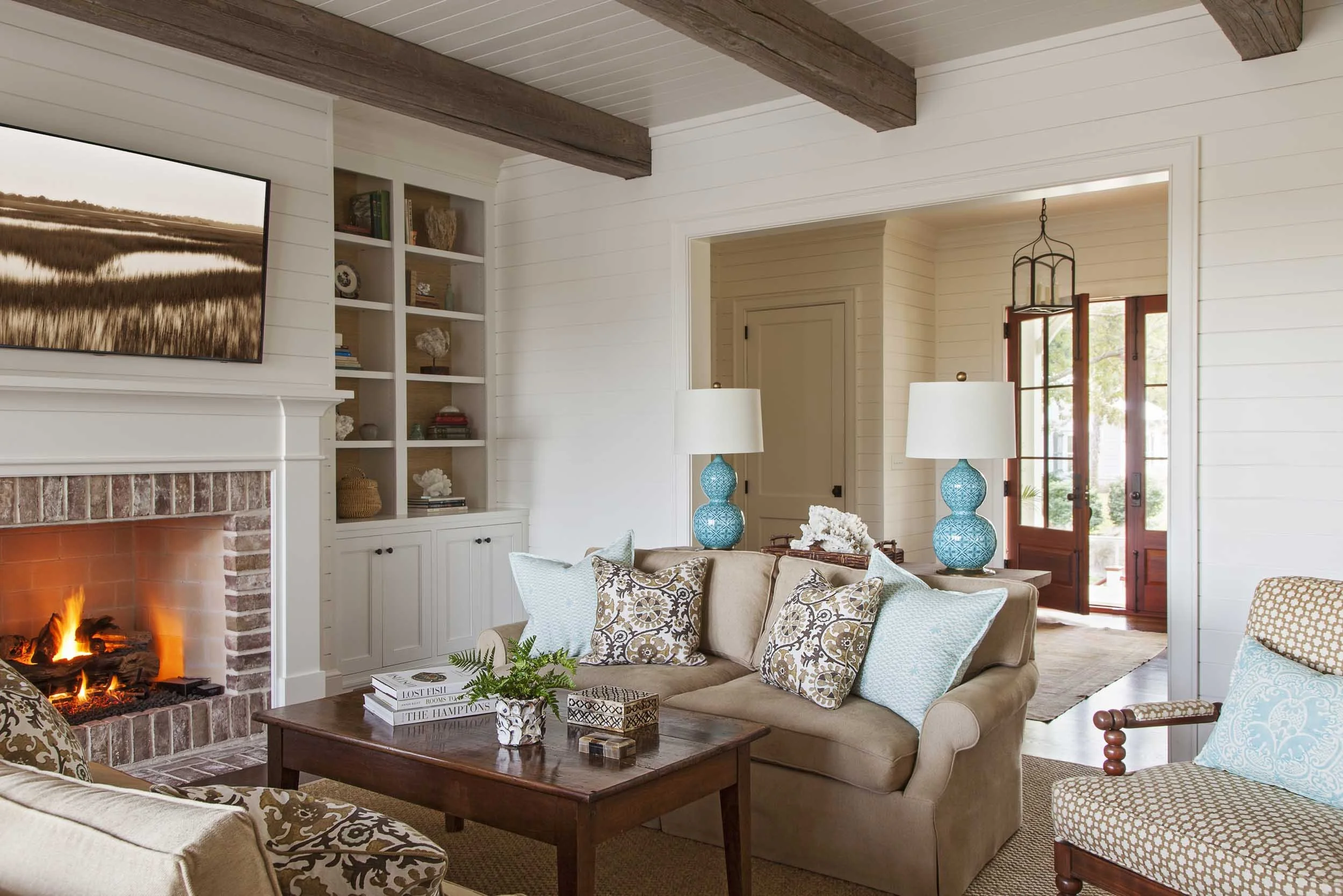 cozy-living-room-white-wood-paneling-custom-built-ins.jpg