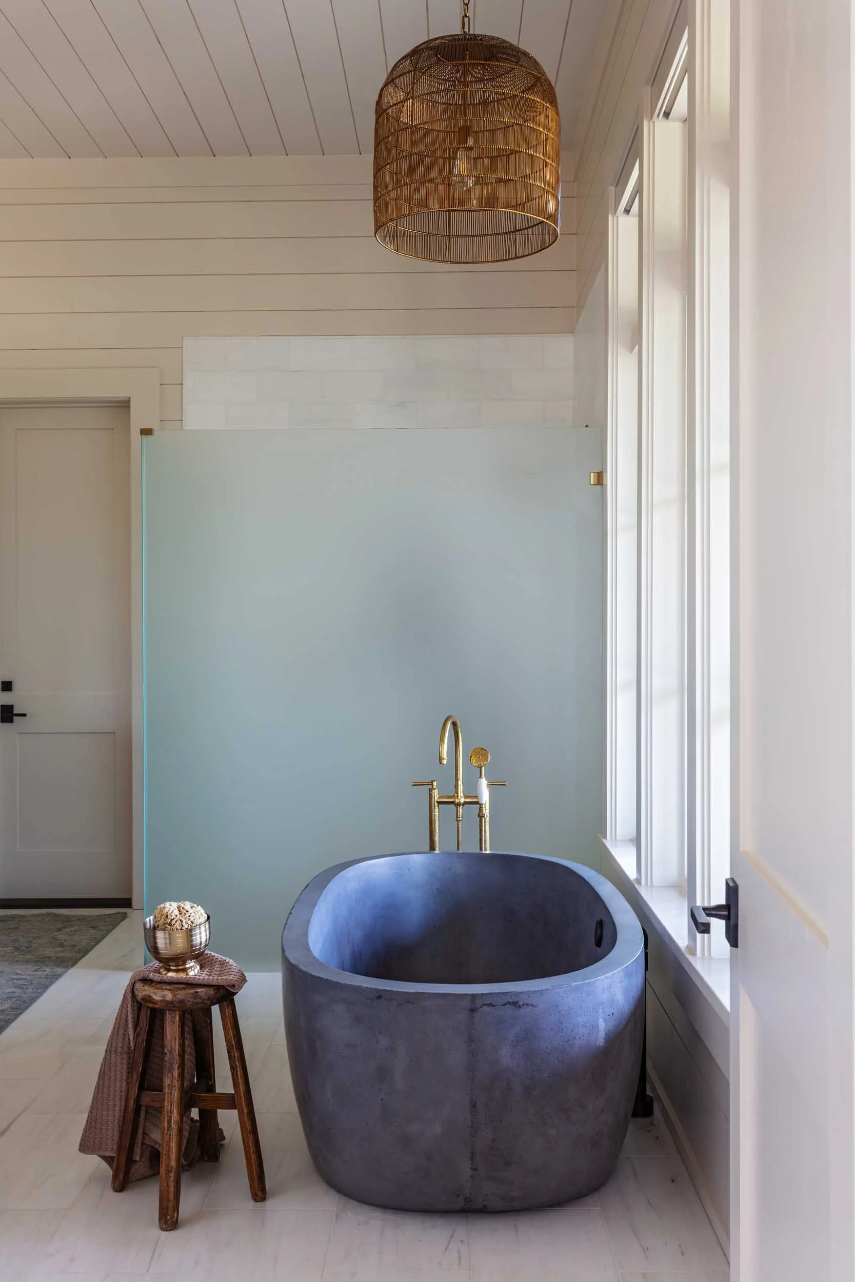 stone-bath-soaking-tub-rohl-antique-brass-plumbing-fixtures.jpg