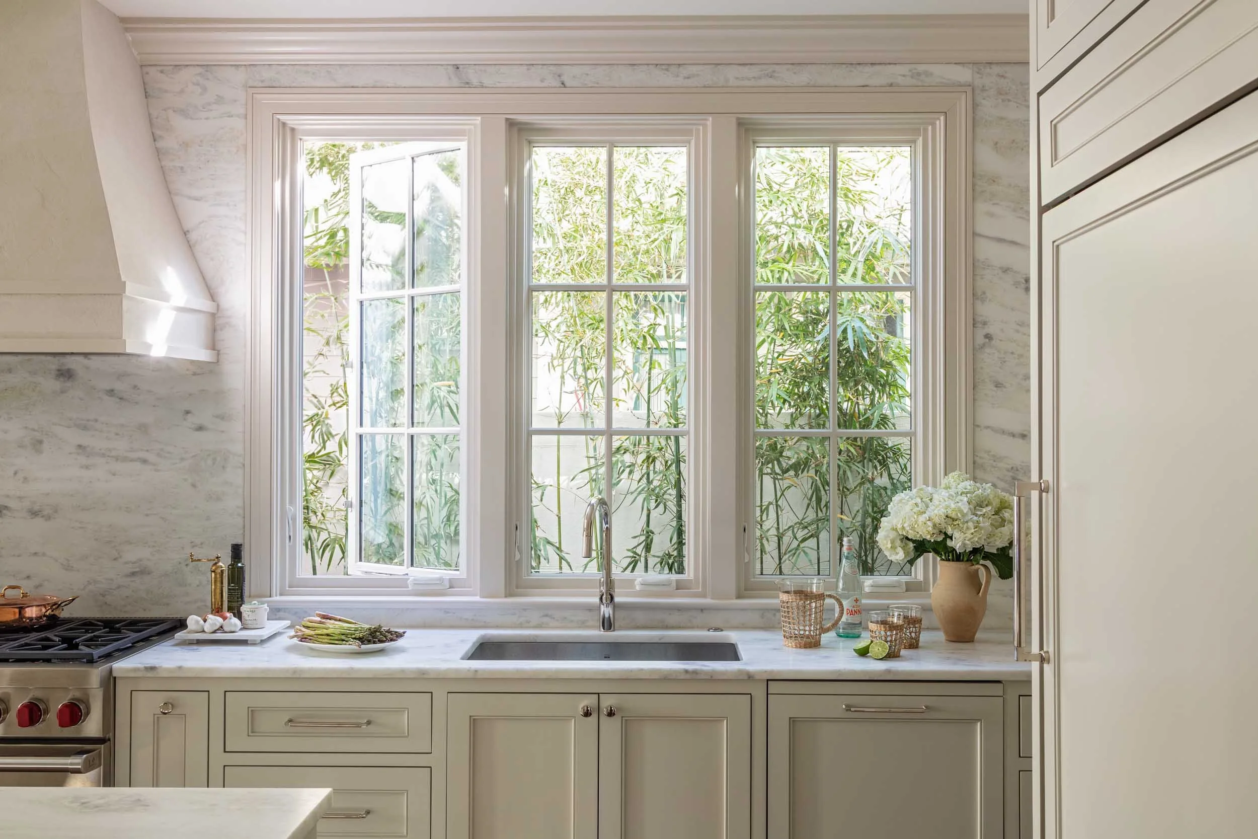 kitchen-sink-trio-windows-bamboo-landscape-marble-counters.jpg