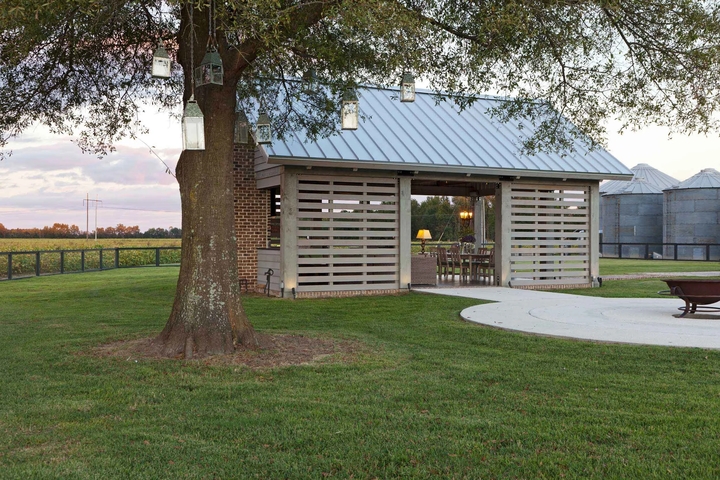 gazebo-and-firepit-shaded-under-oak-tree-with-lanterns.jpg