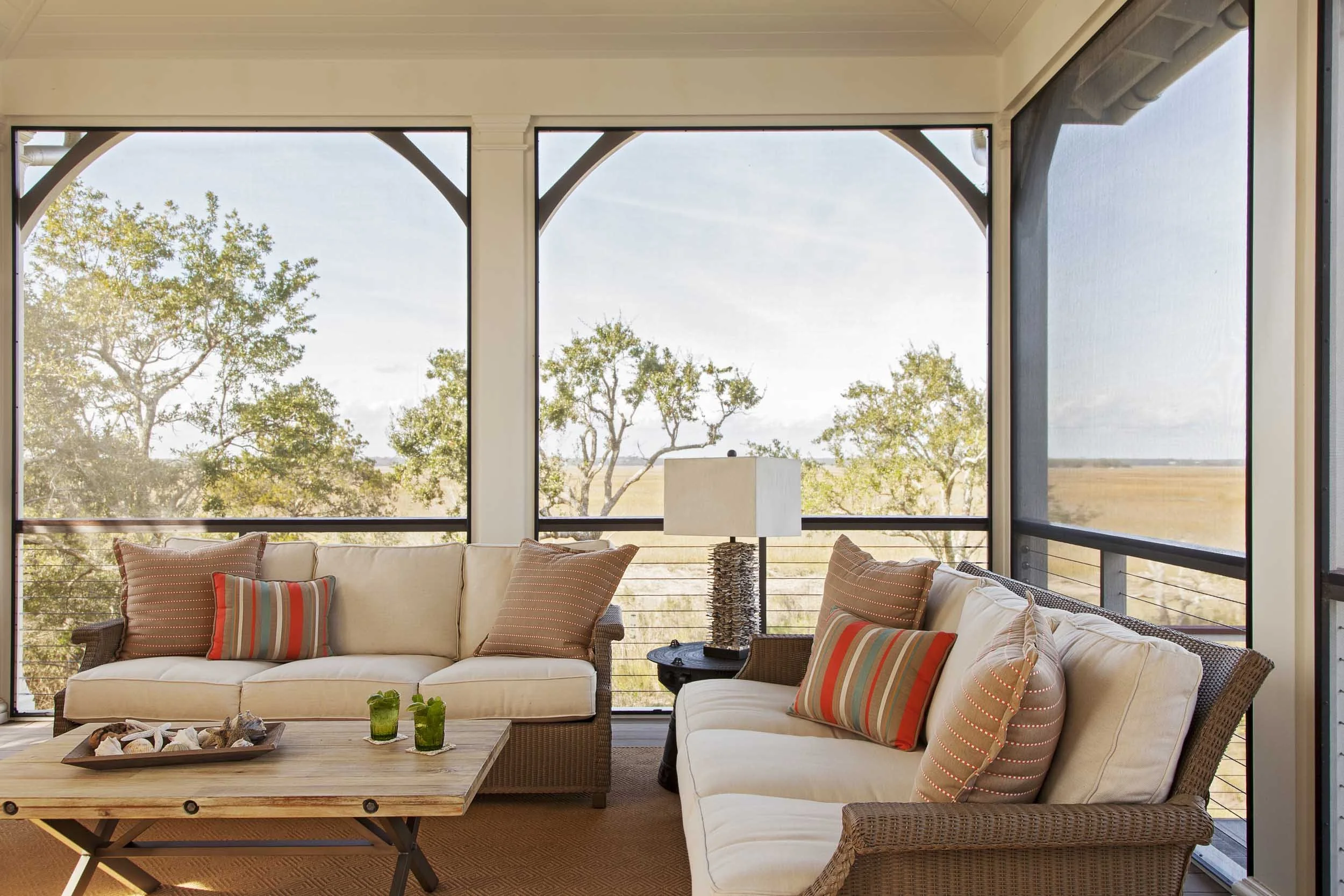 screened-porch-with-expansive-marsh-views-wicker-seating.jpg