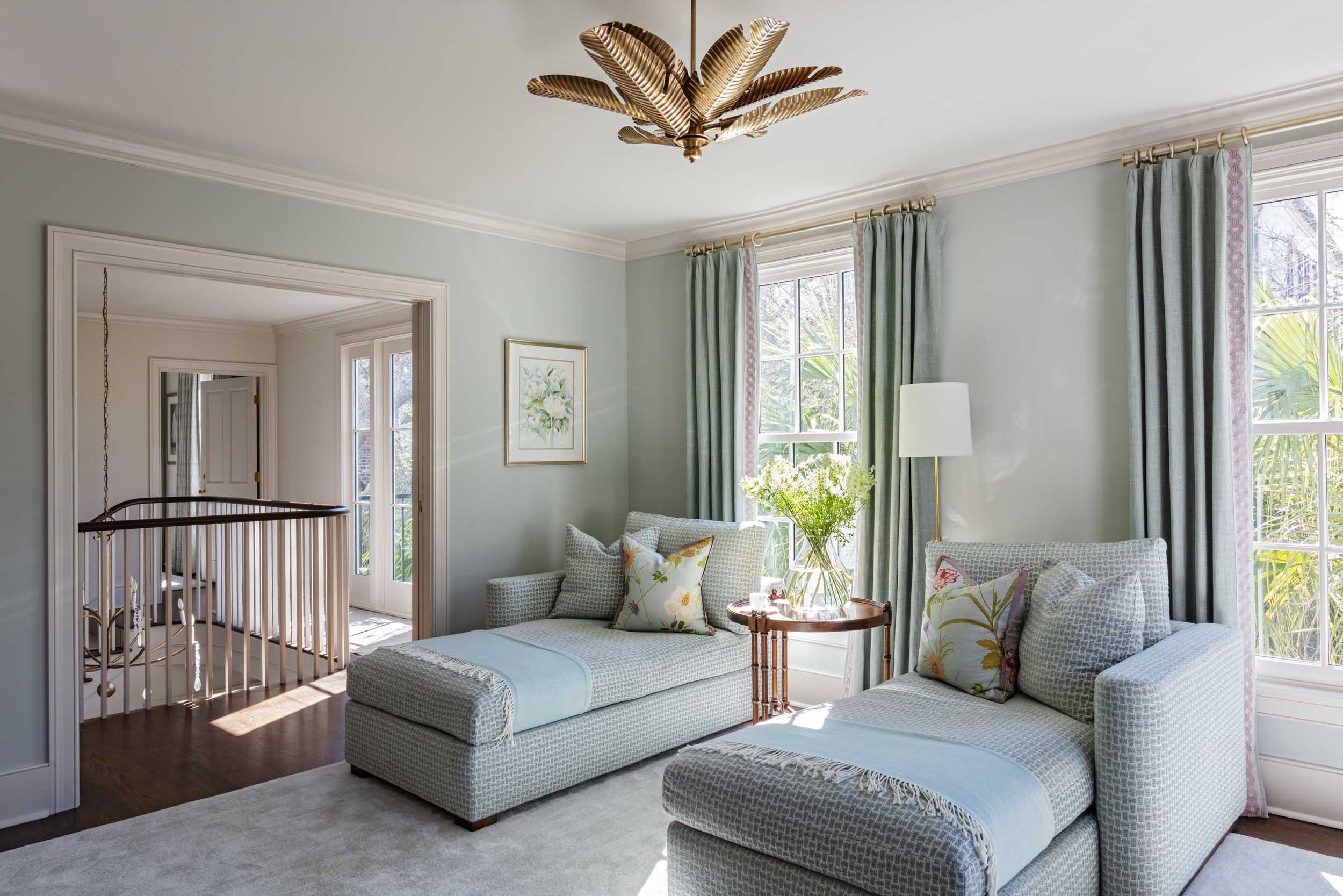 primary-sitting-room-his-her-chaise-lounges-curry-and-co-pendant.jpg