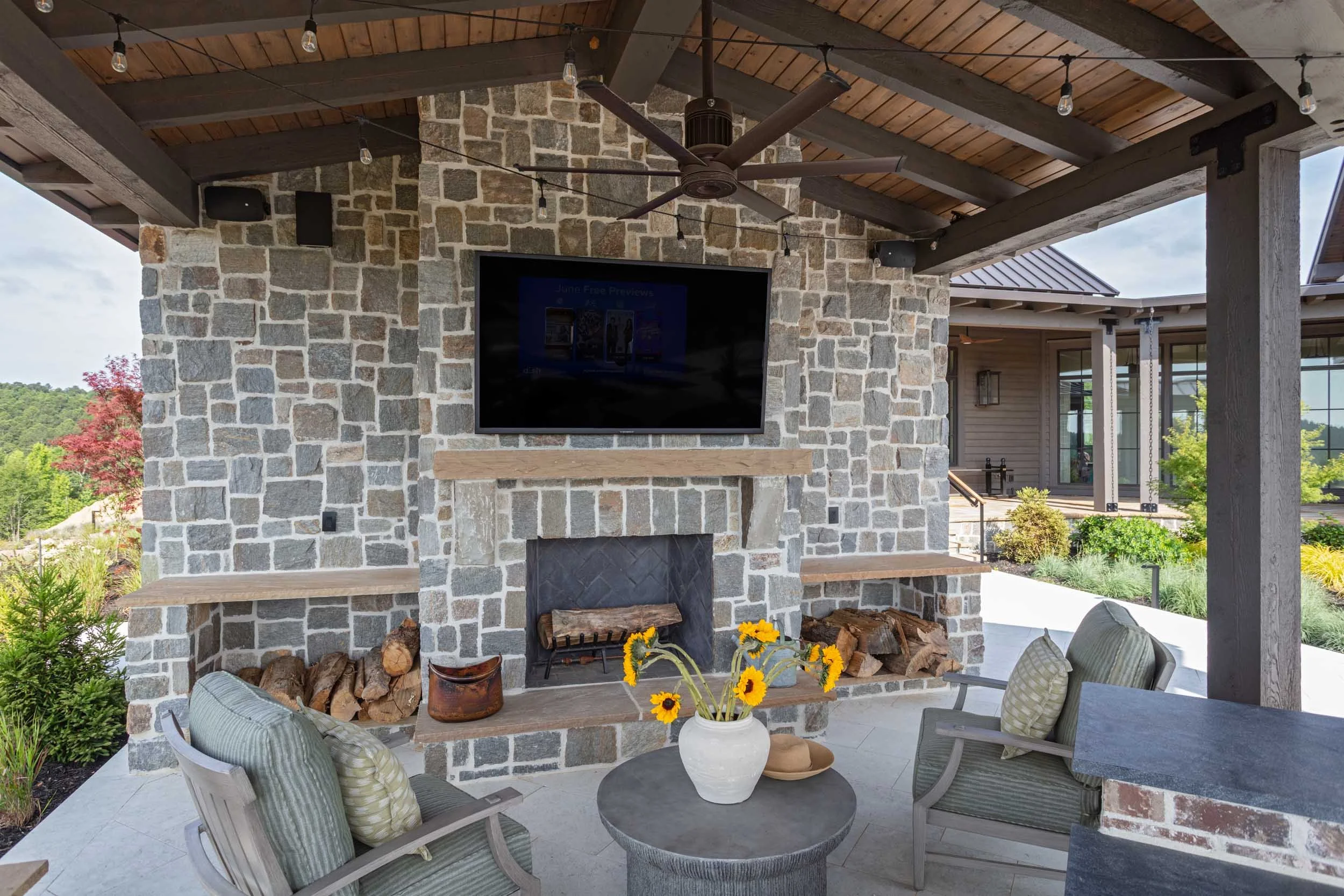 summer-classics-chairs-face-outdoor-stone-fireplace.jpg
