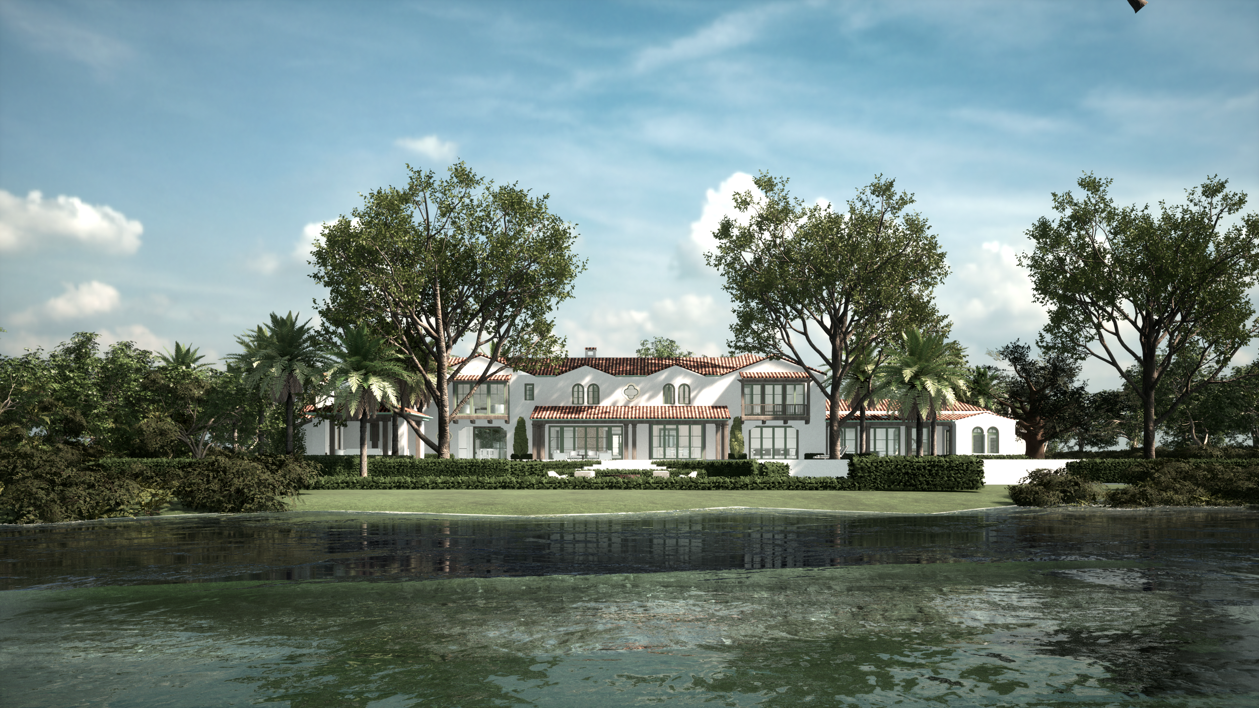 A large white mansion with a red tile roof, surrounded by trees and greenery, reflected in a body of water in the foreground under a partly cloudy sky.