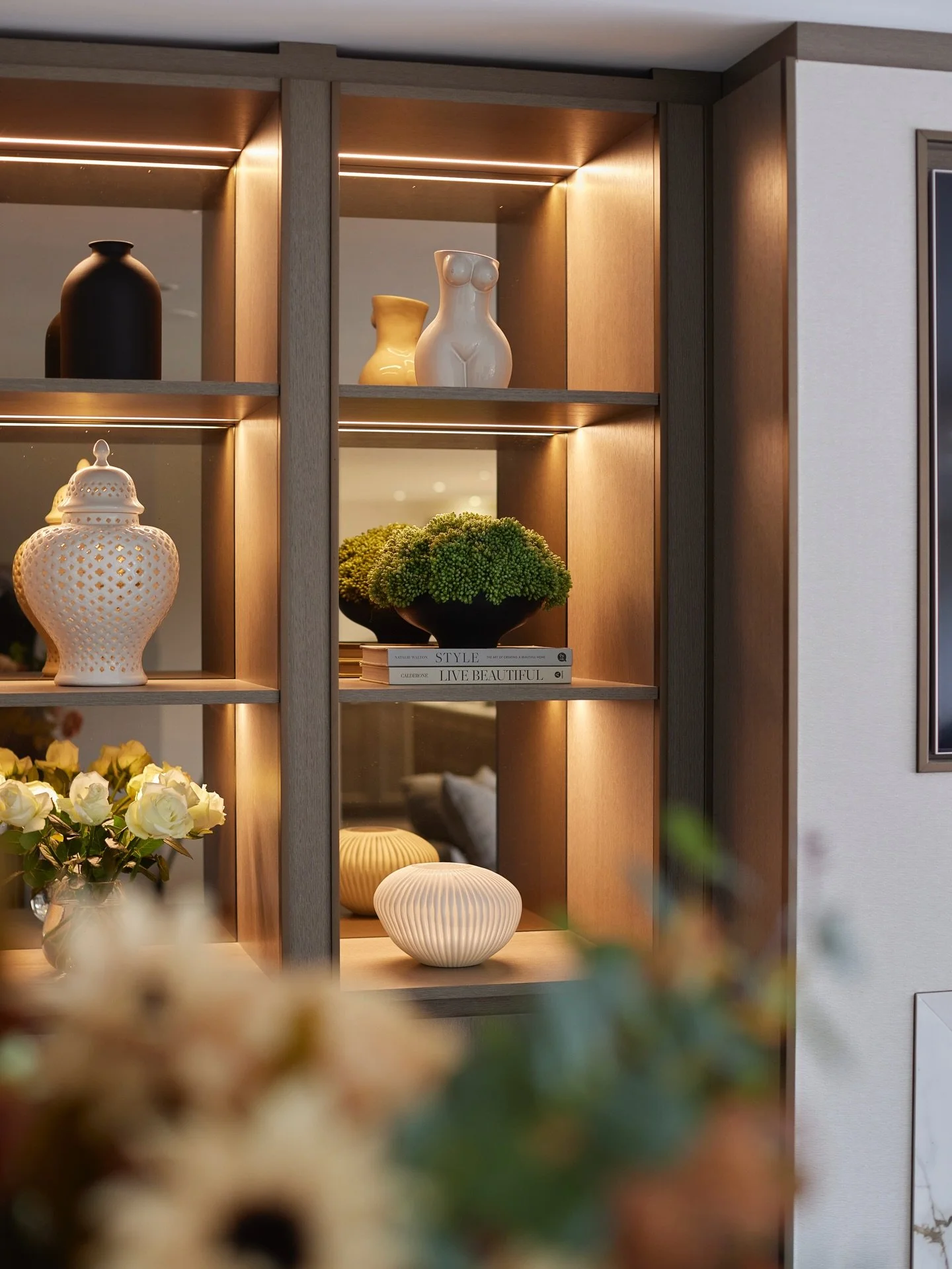 The Day Living at Hawthorn House already featured a central fire and TV wall, and our client asked us to update the cabinetry to bring it in line with the rest of the home.

We introduced fitted cabinetry to either side, combining practical storage w