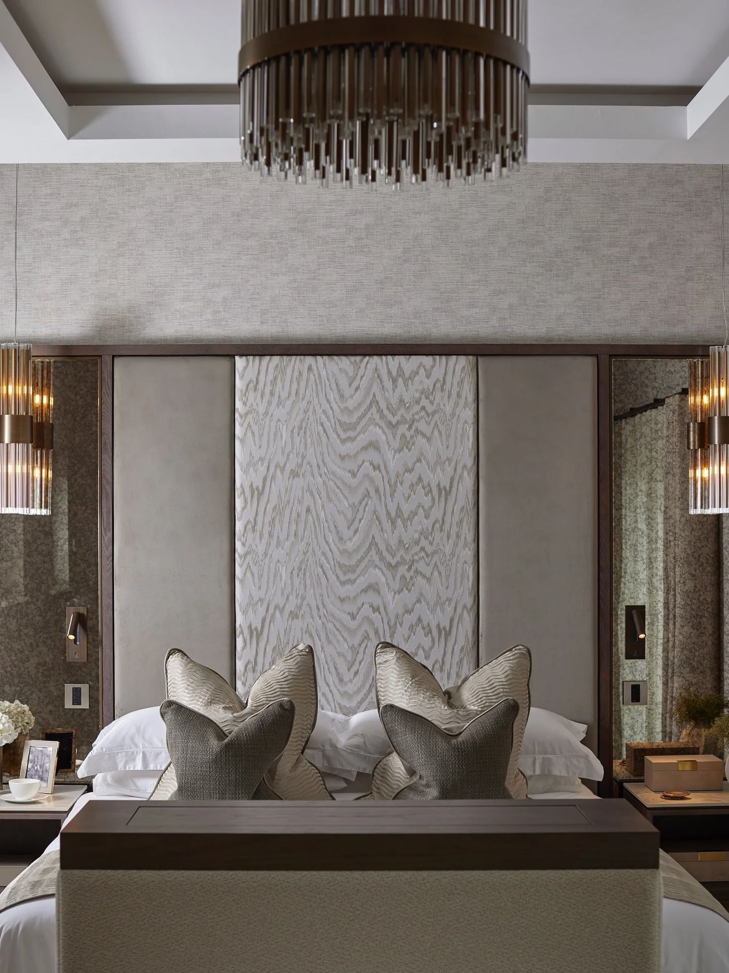 Hawthorn House - before &amp; after ✨

This master suite was designed as part of a new extension, creating a flowing, hotel-style layout with clearly defined zones.
The statement headboard layers multiple materials and discreetly conceals a hidden do