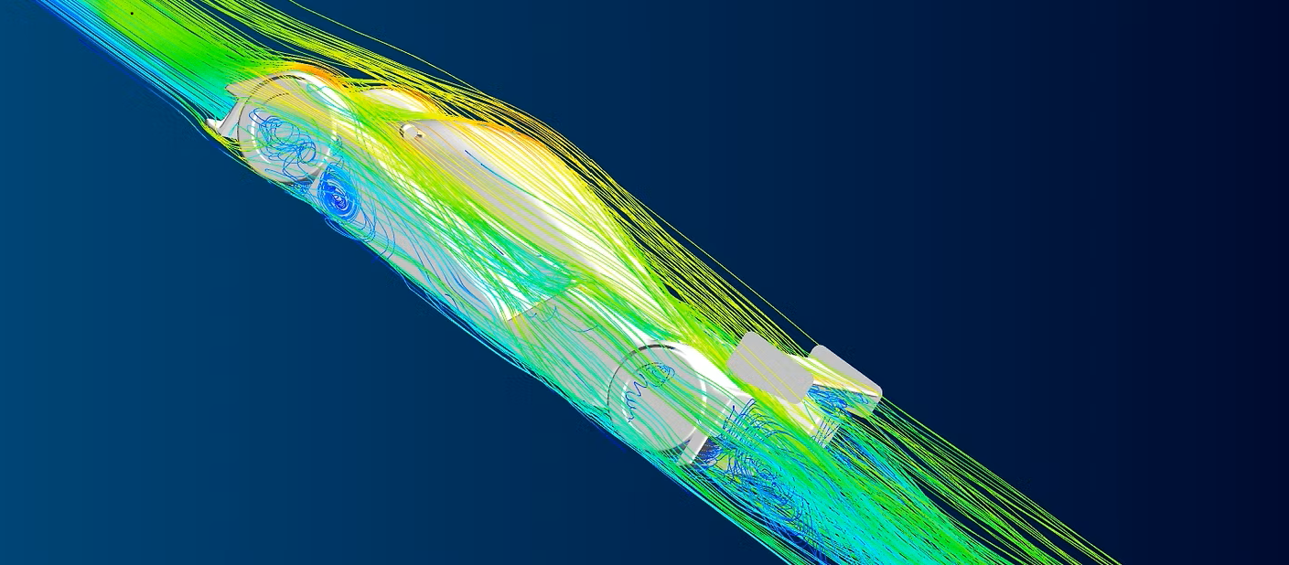 Computer simulation of airflow over an aerodynamic object with streamlines and color-coded flow patterns.