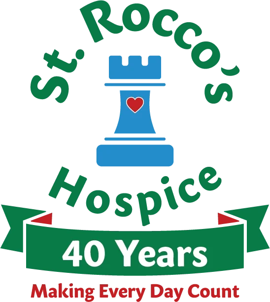 Logo for St. Roccos Hospice featuring a blue chess rook with a red heart, surrounded by green text reading 'St. Roccos Hospice' at the top and bottom, with a green banner in the center that says '40 Years,' and a red tagline at the bottom that says 'Making Every Day Count.'