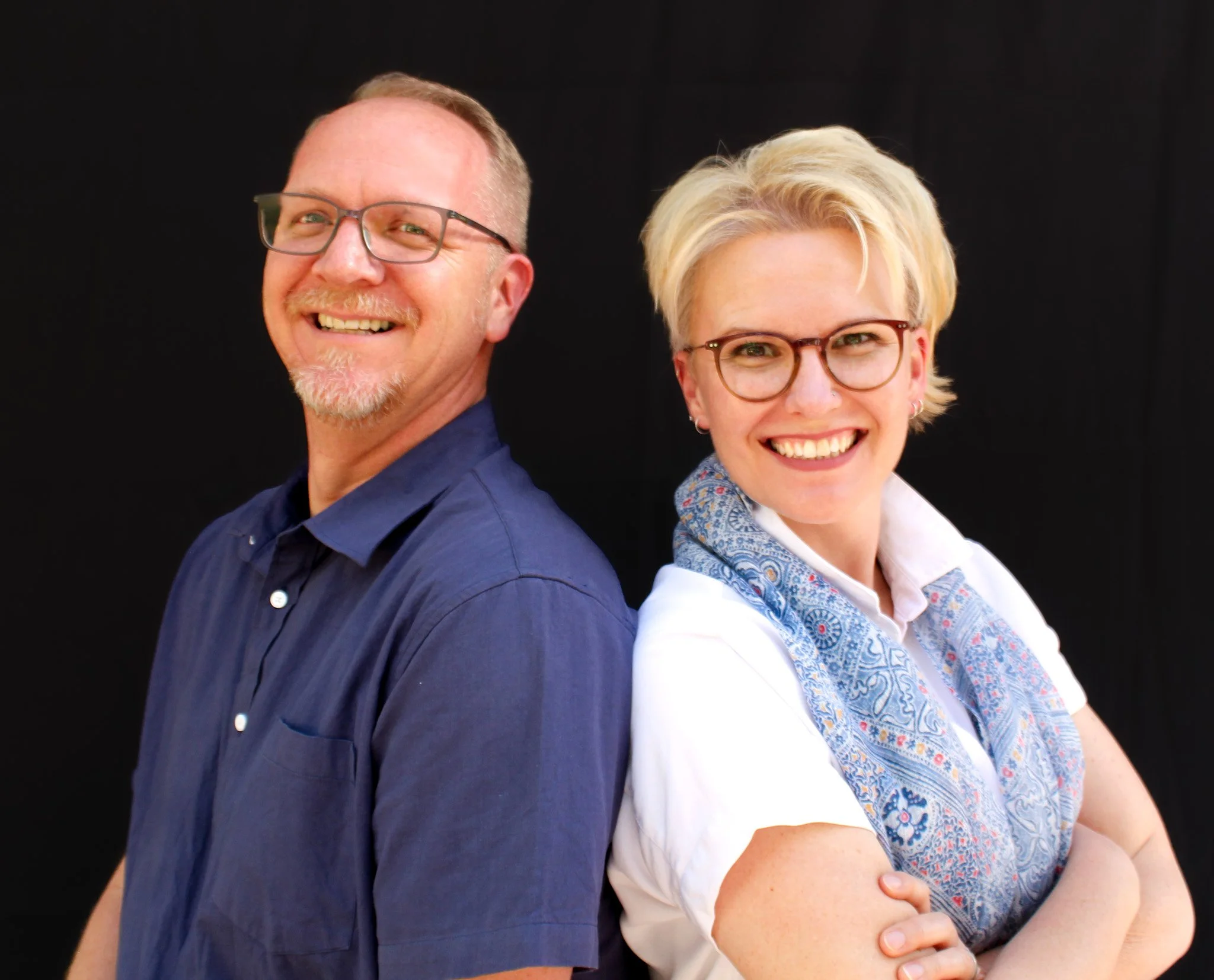 Josh and Haley Snyder, of Mozen, stand back-to-back showing their commitment to work as a team. Professionally dressed and ready to understand their clients needs to provide excellent service and detailed data through honest and consistent reporting.