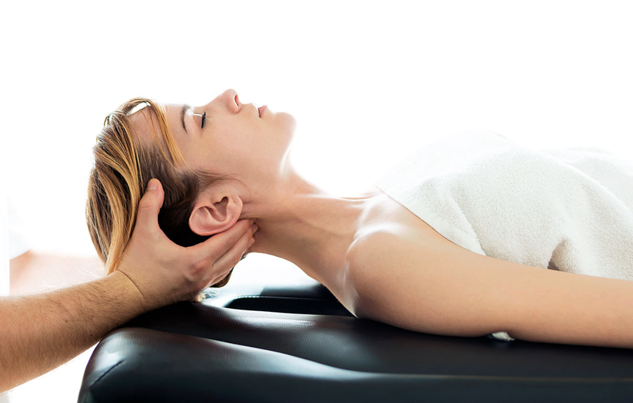 Chiropractor evaluating patient after car accident in Andover MA