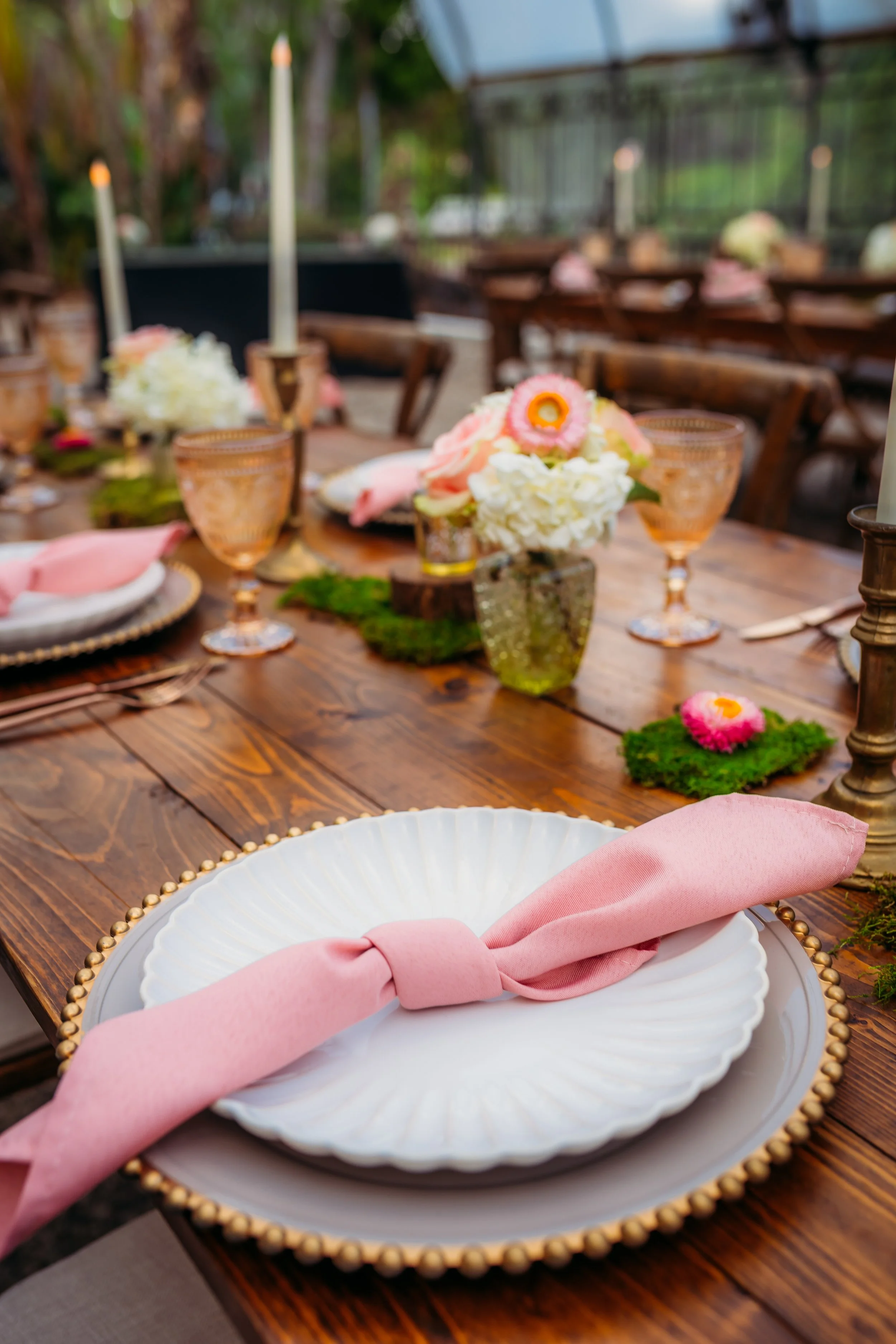 Fairytale wedding reception beneath chandeliers and warm twinkle lights