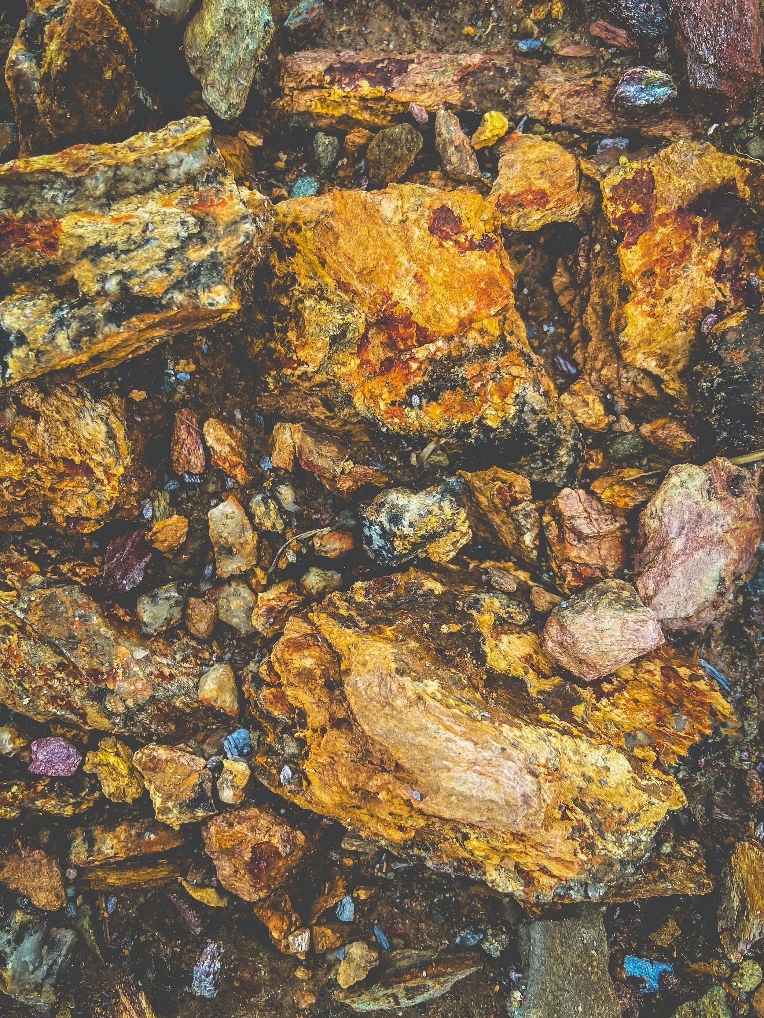 Close-up of various rocks and small stones with different colors and textures.