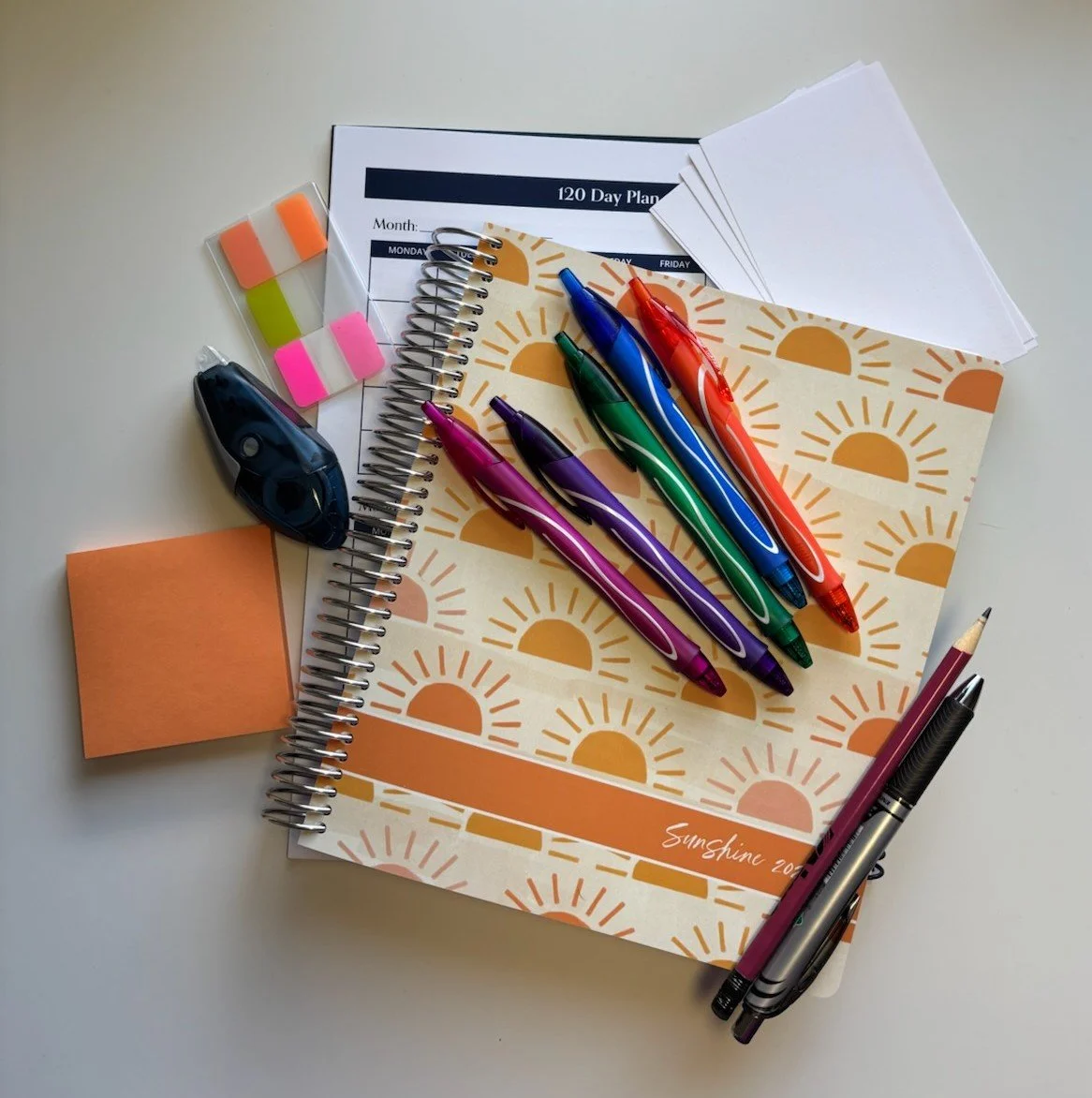 Planning purposely with planner, calendar, pens, tabs, index cards, and sticky notes to leverage life goals