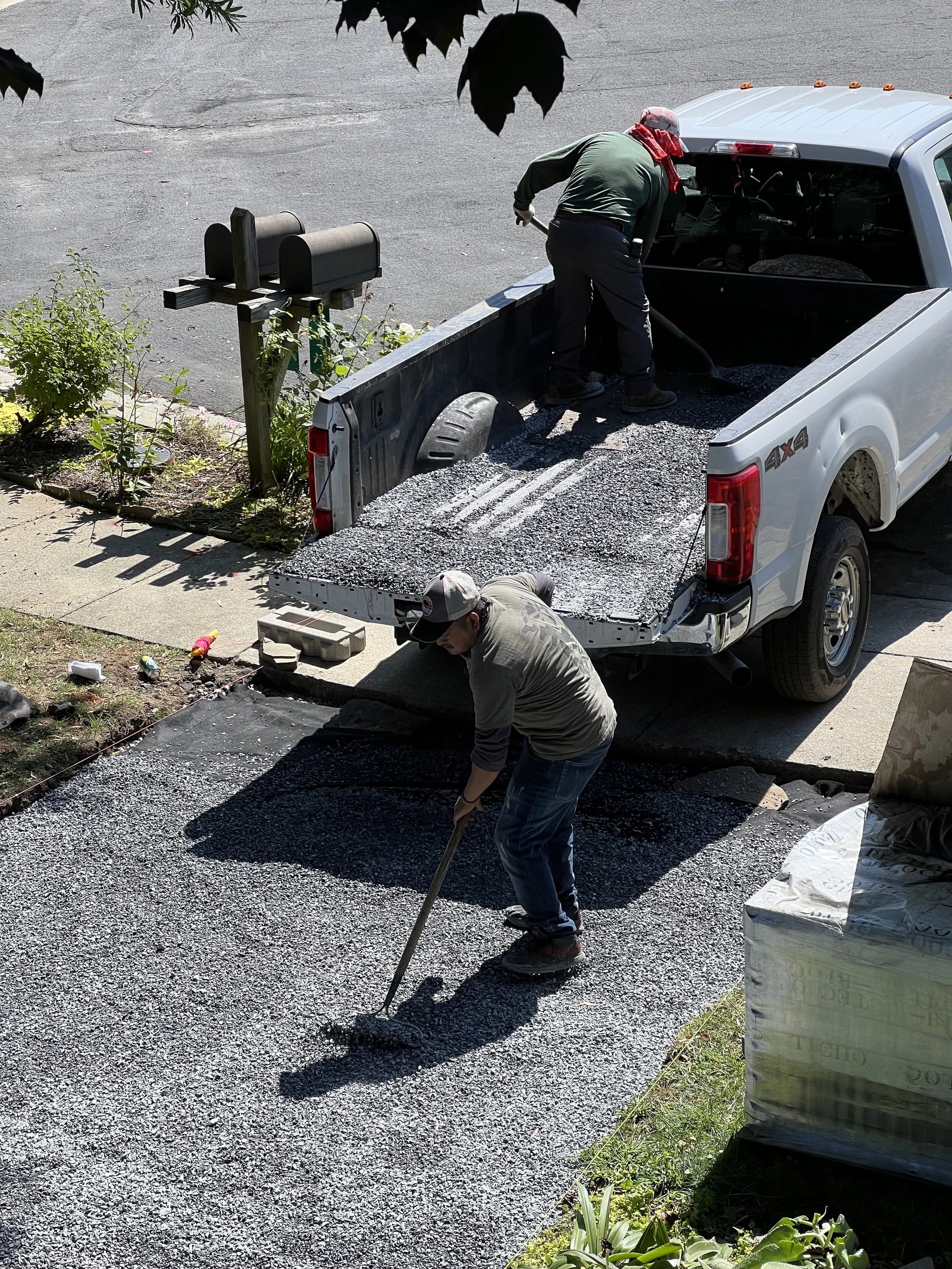 The #57 clean rock is leveled and raked. Then, another layer of stabilization topped with smaller #8 clean stone. 