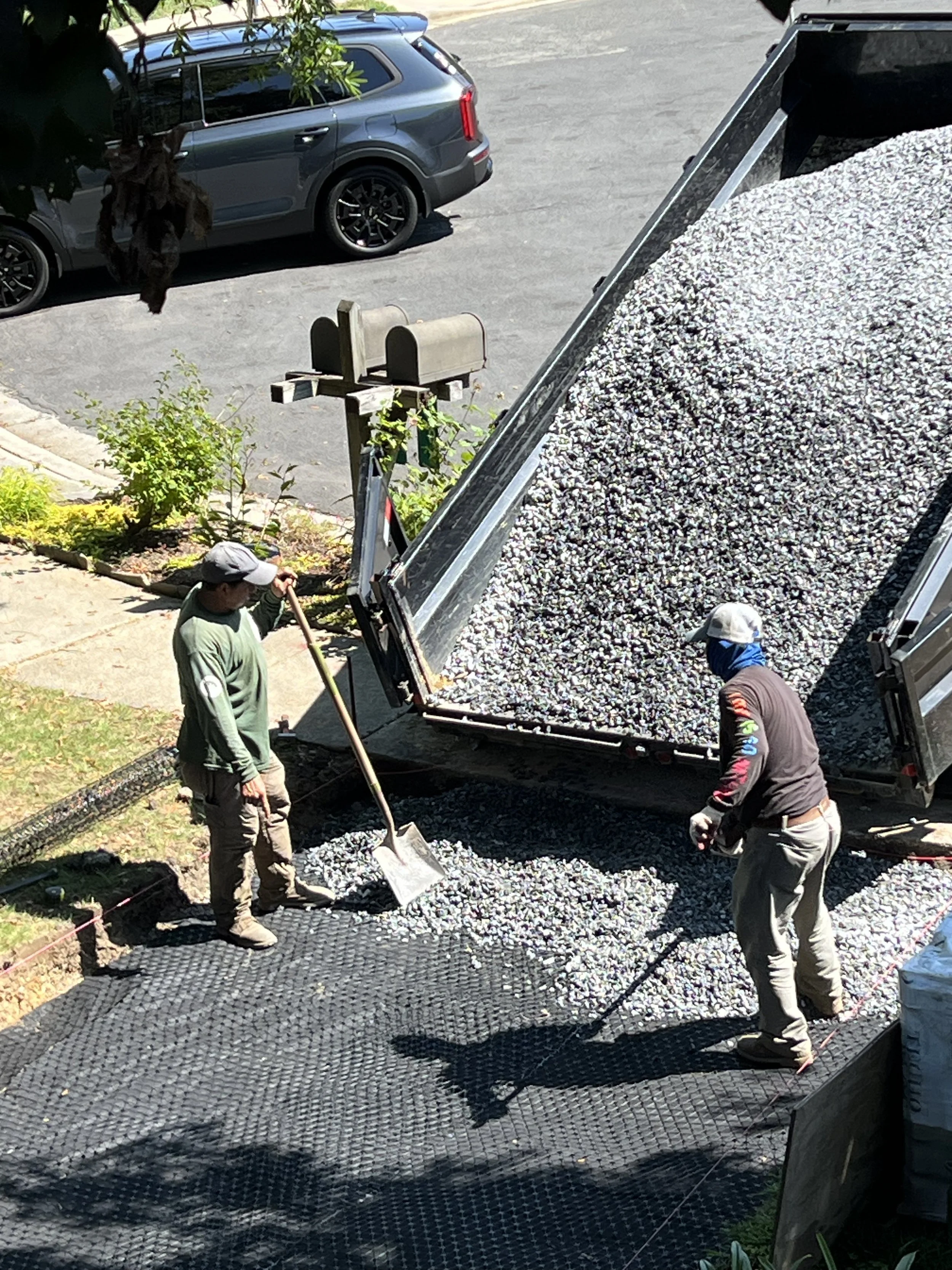 The geofabric is followed by geogrid for stabilization - then #57 clean rock.