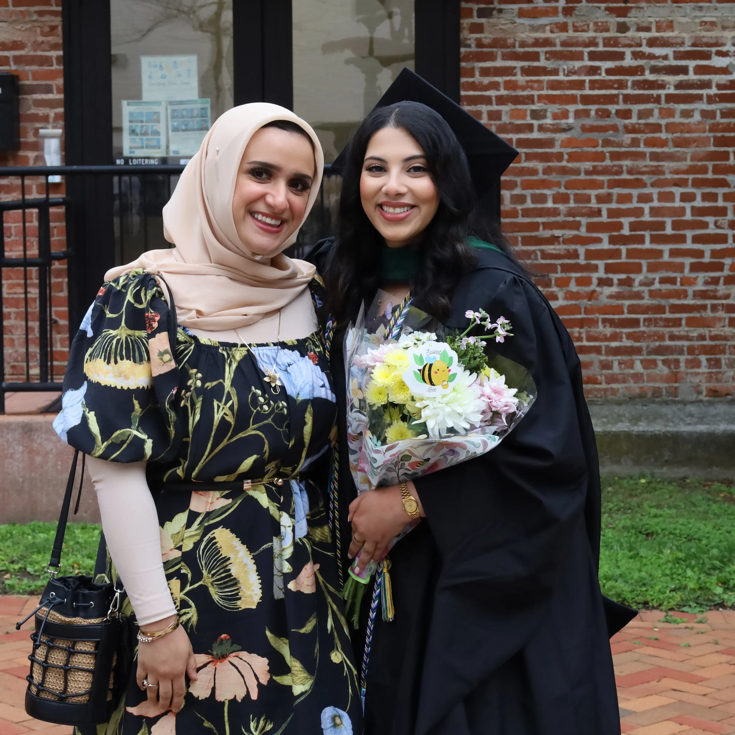 USMH student celebrating graduation with family member.