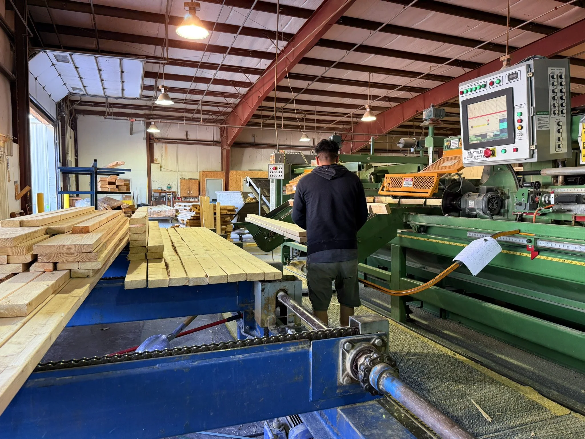 Oranssi technician working on a roof project