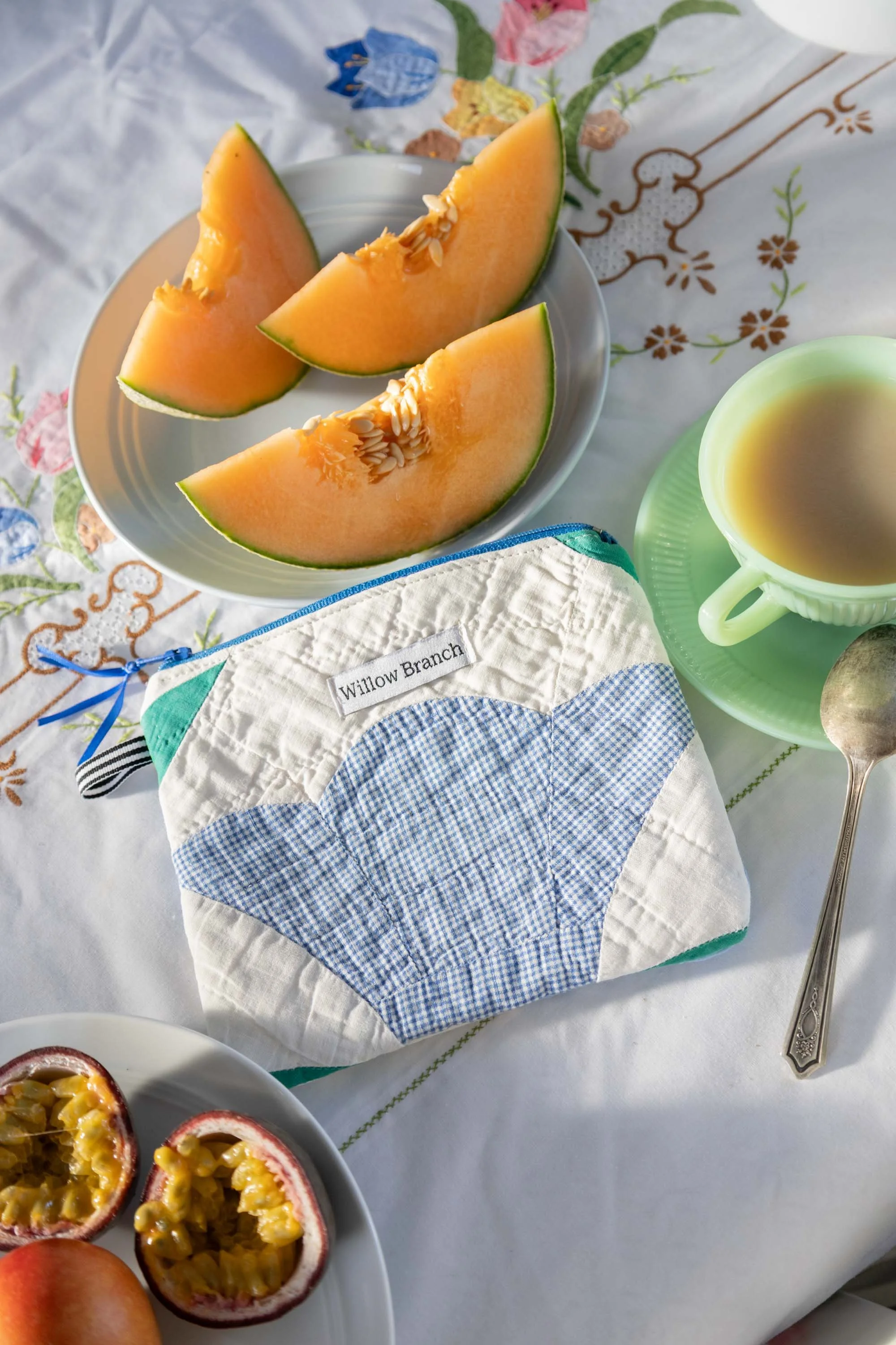 Willow Branch flat pouch using vintage tulip quilt in a really cute set up. Cantaloupe, a jadite Fireking tea cup .