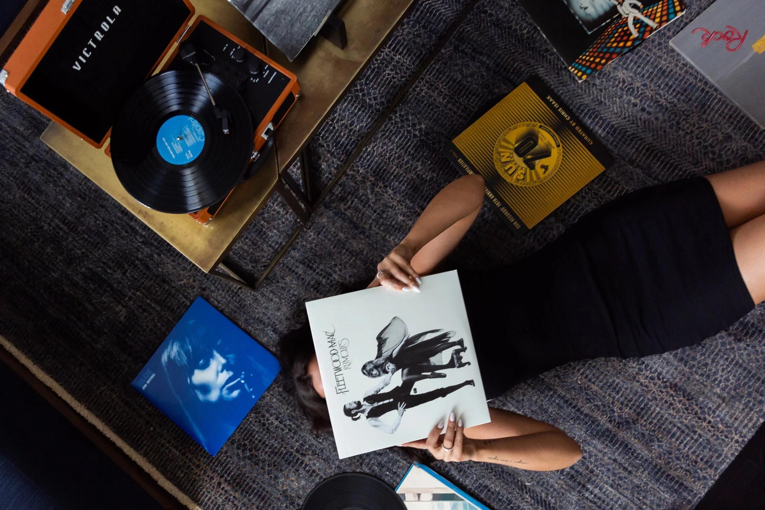 woman listening to vinyl records