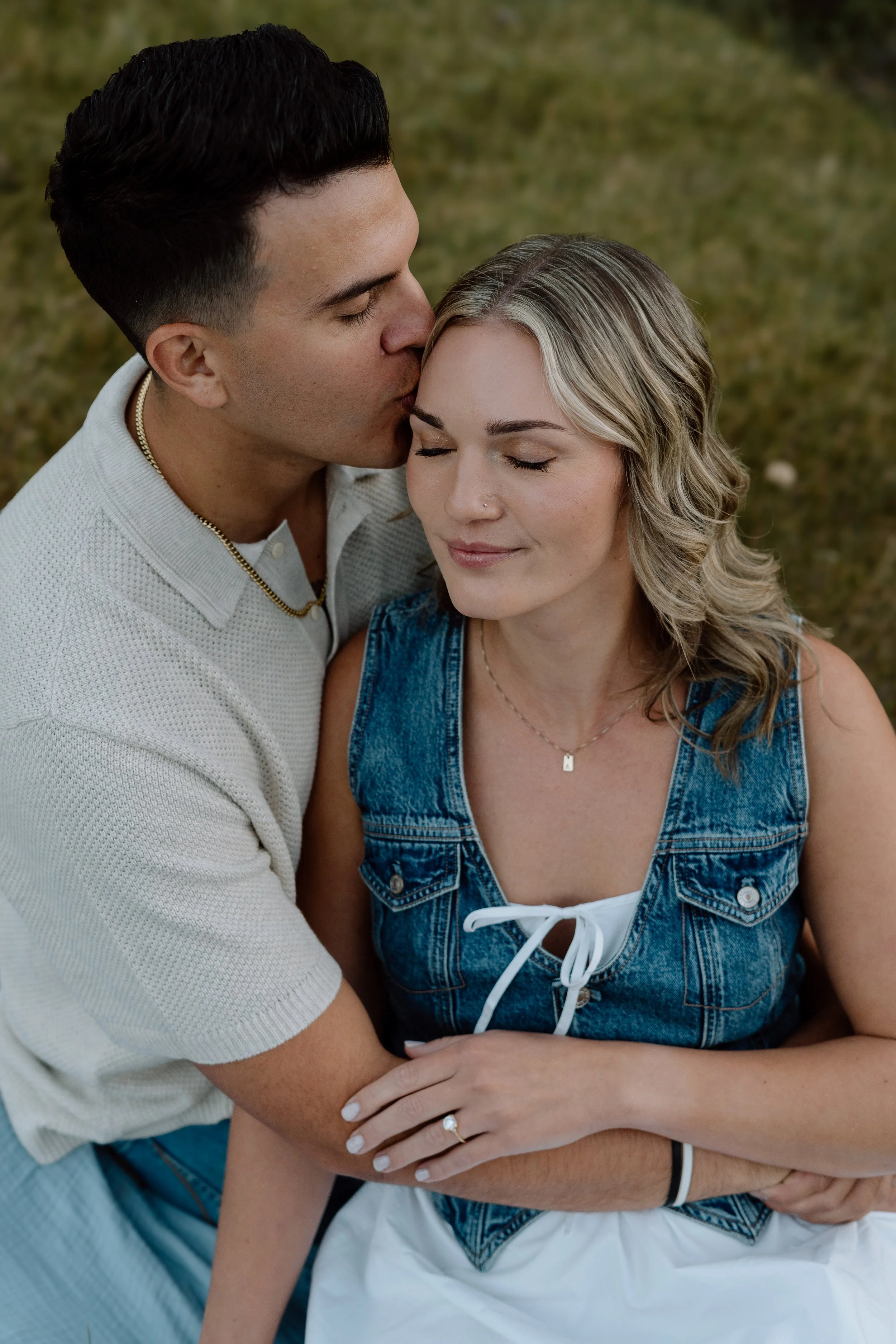 couple-cuddling-and-man-kissing-forehead.jpg