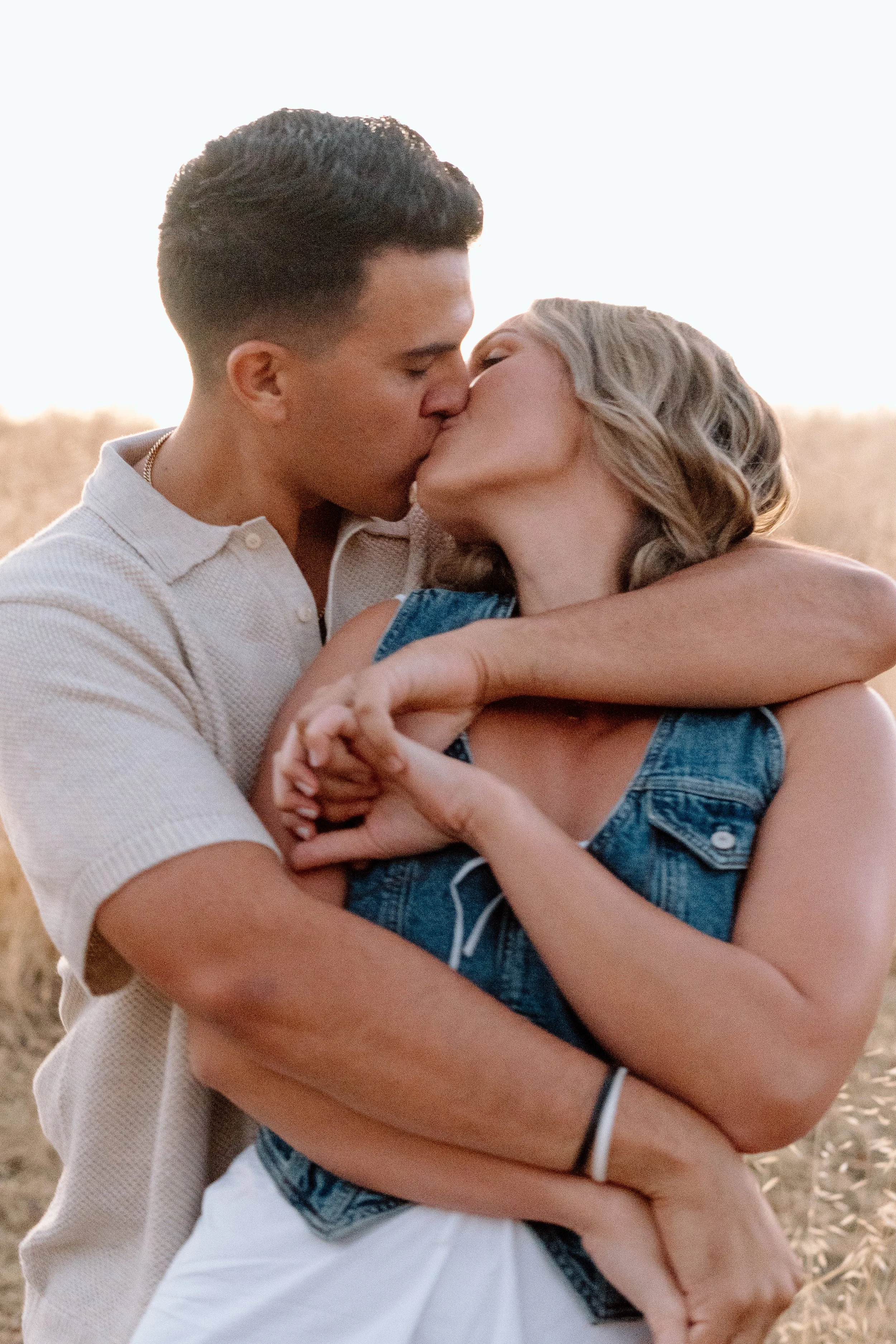 couple-tangled-in-eachothers-arms-kissing.jpg