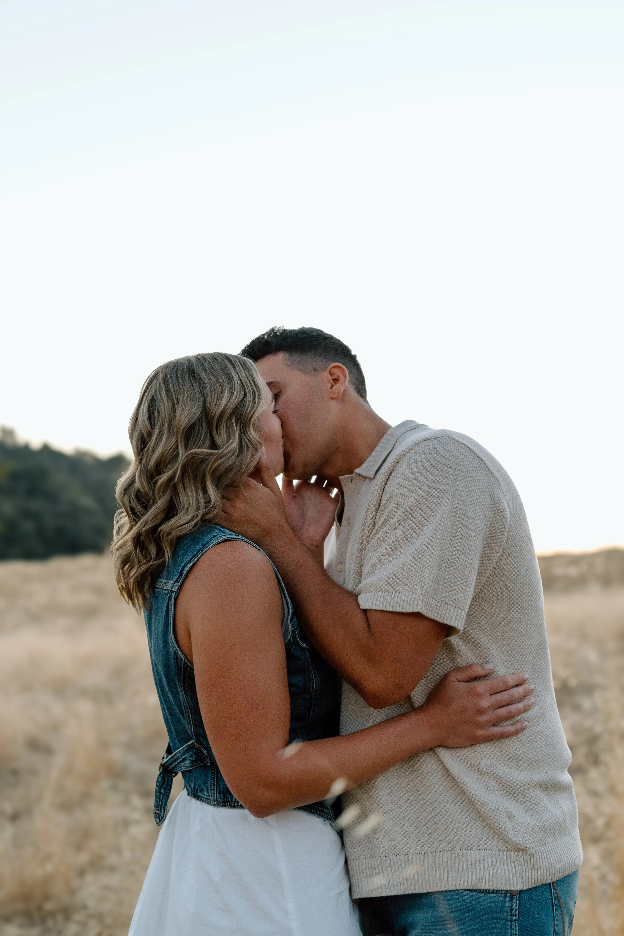 engaged-couple-kissing-at-sunset.jpg