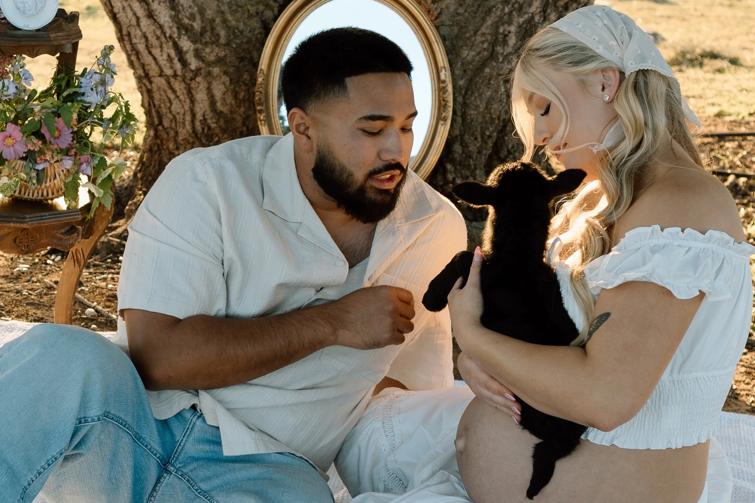 pregnant-couple-holding-baby-goat.jpg