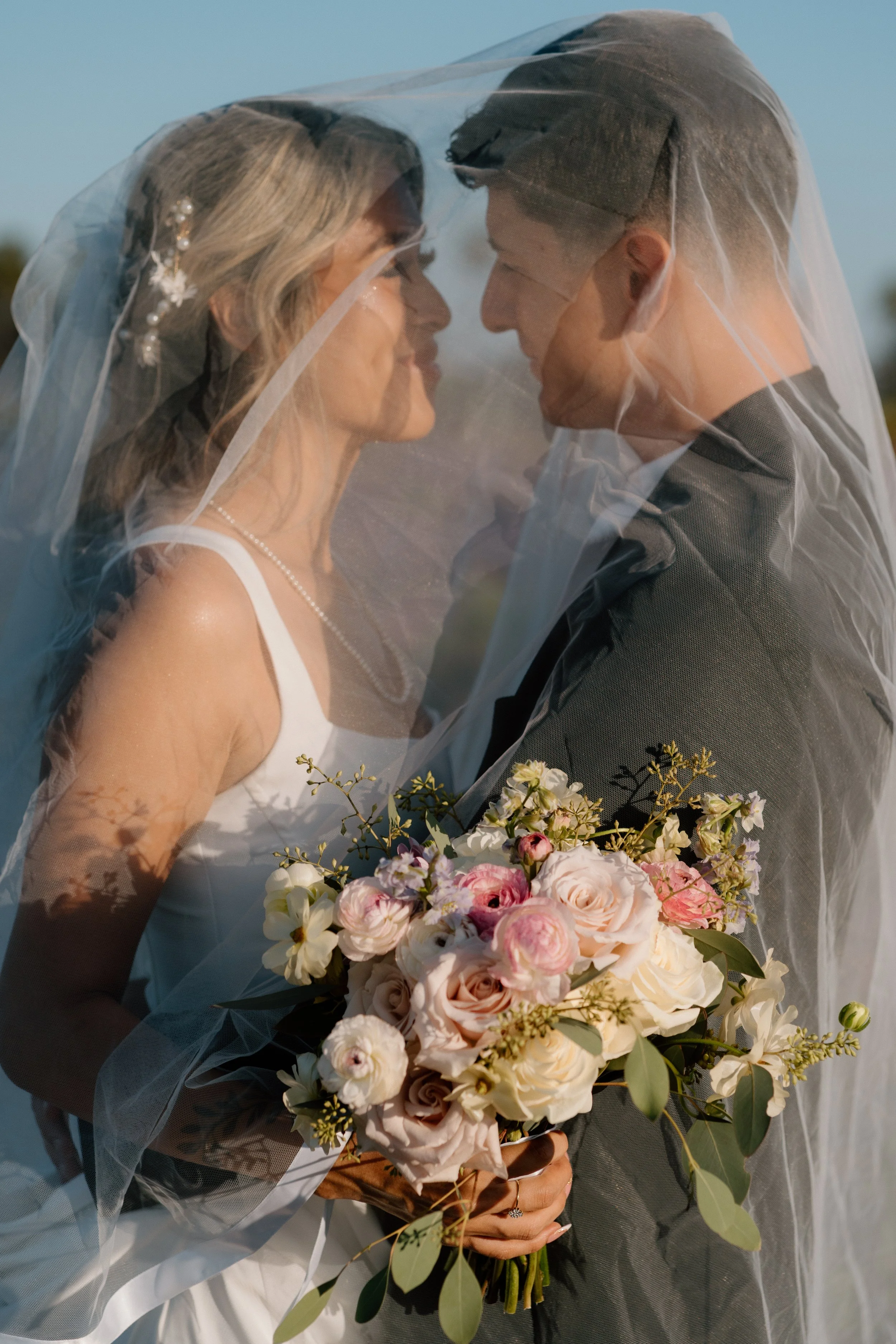 Bride-and-Groom-Under-Veil.jpg