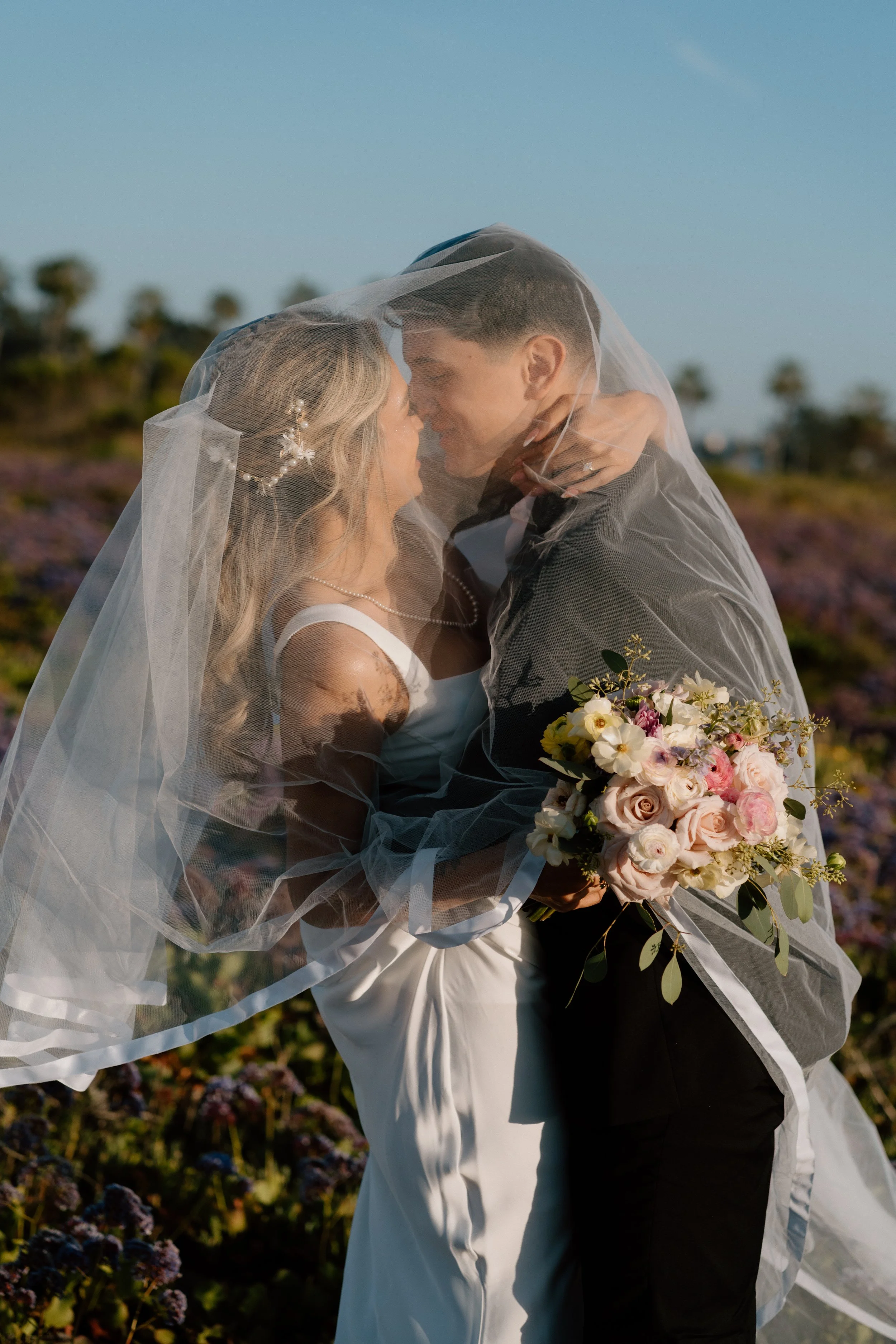 Bride-and-Groom-Under-Veil-3.jpg