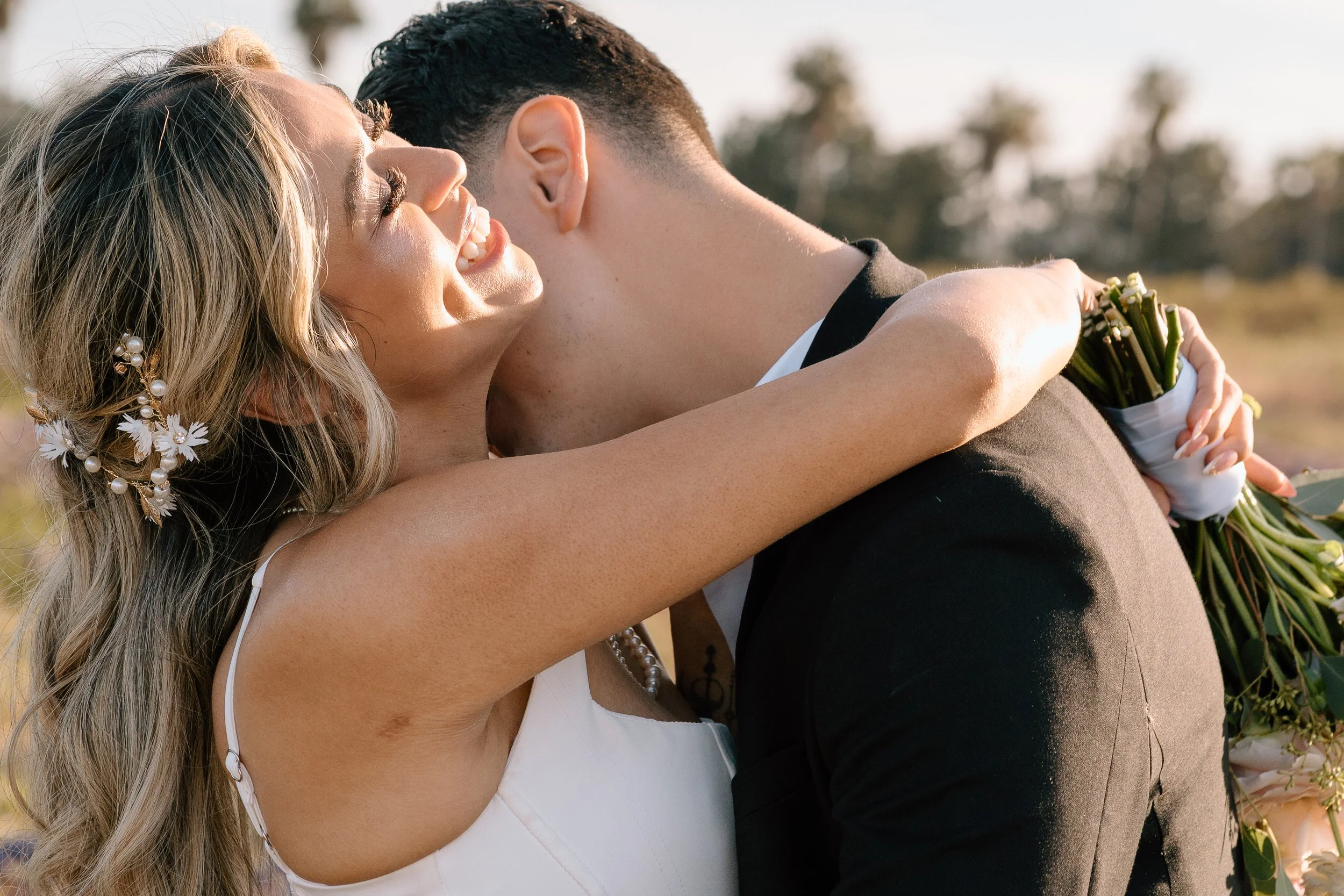 Groom-kissing-brides-neck.jpg