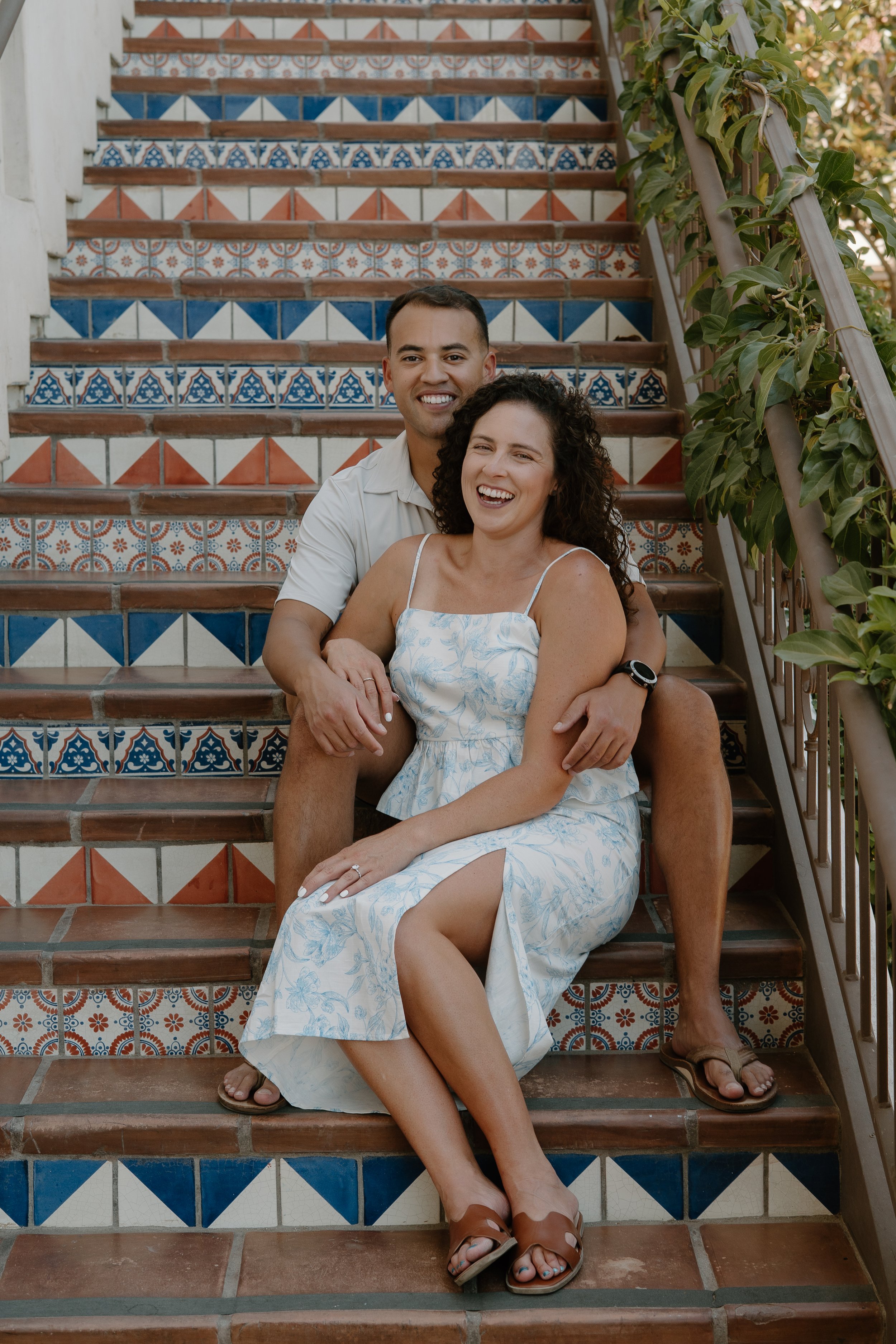 newly-engaged-couple-sitting-on-steps.jpg