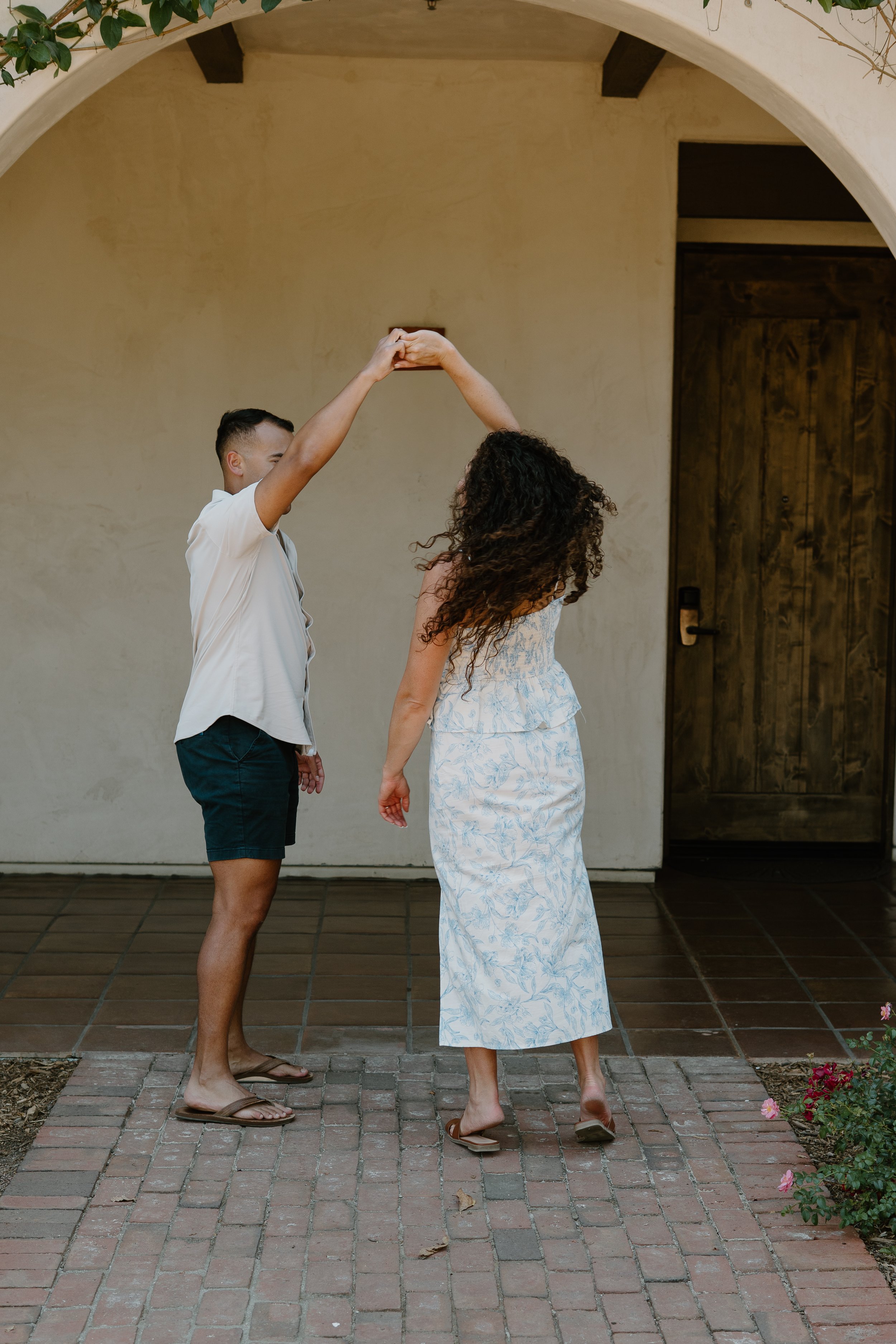 man-twirlling-fiance-temecula-winery.jpg