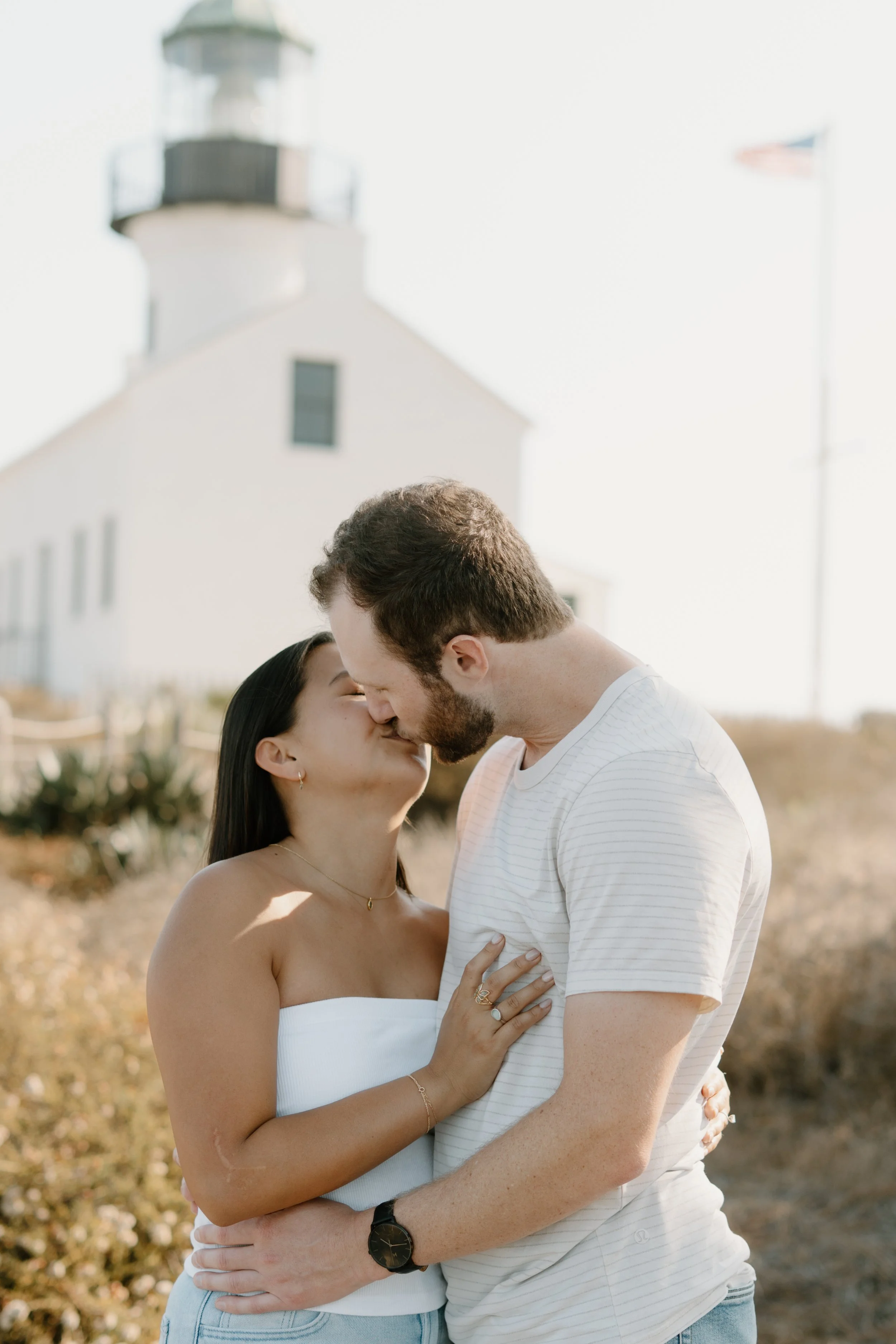 couple-kissing-in-front-of-lighthouse.jpg