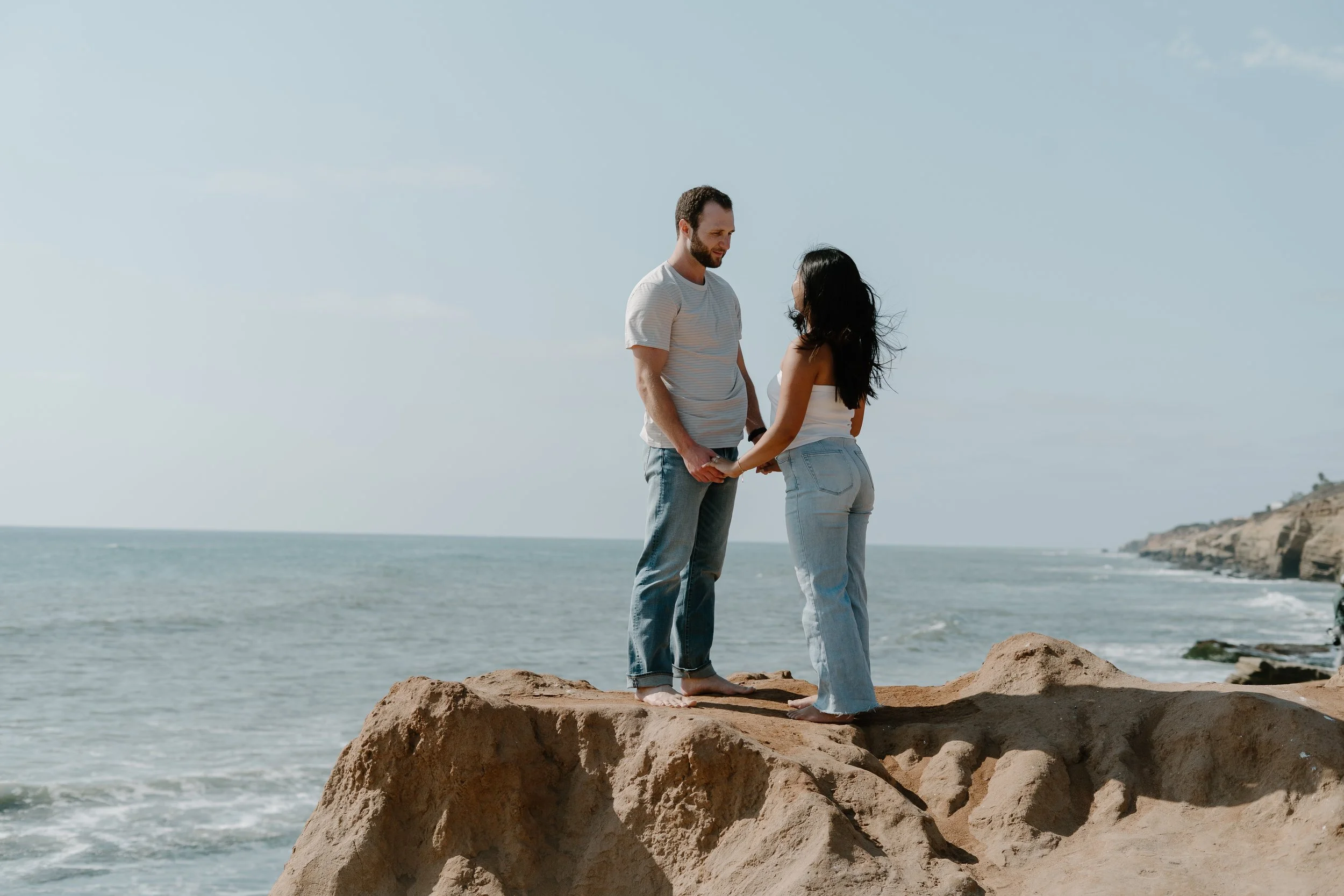 couple-standing-cliff-side-la-jolla-beach.jpg