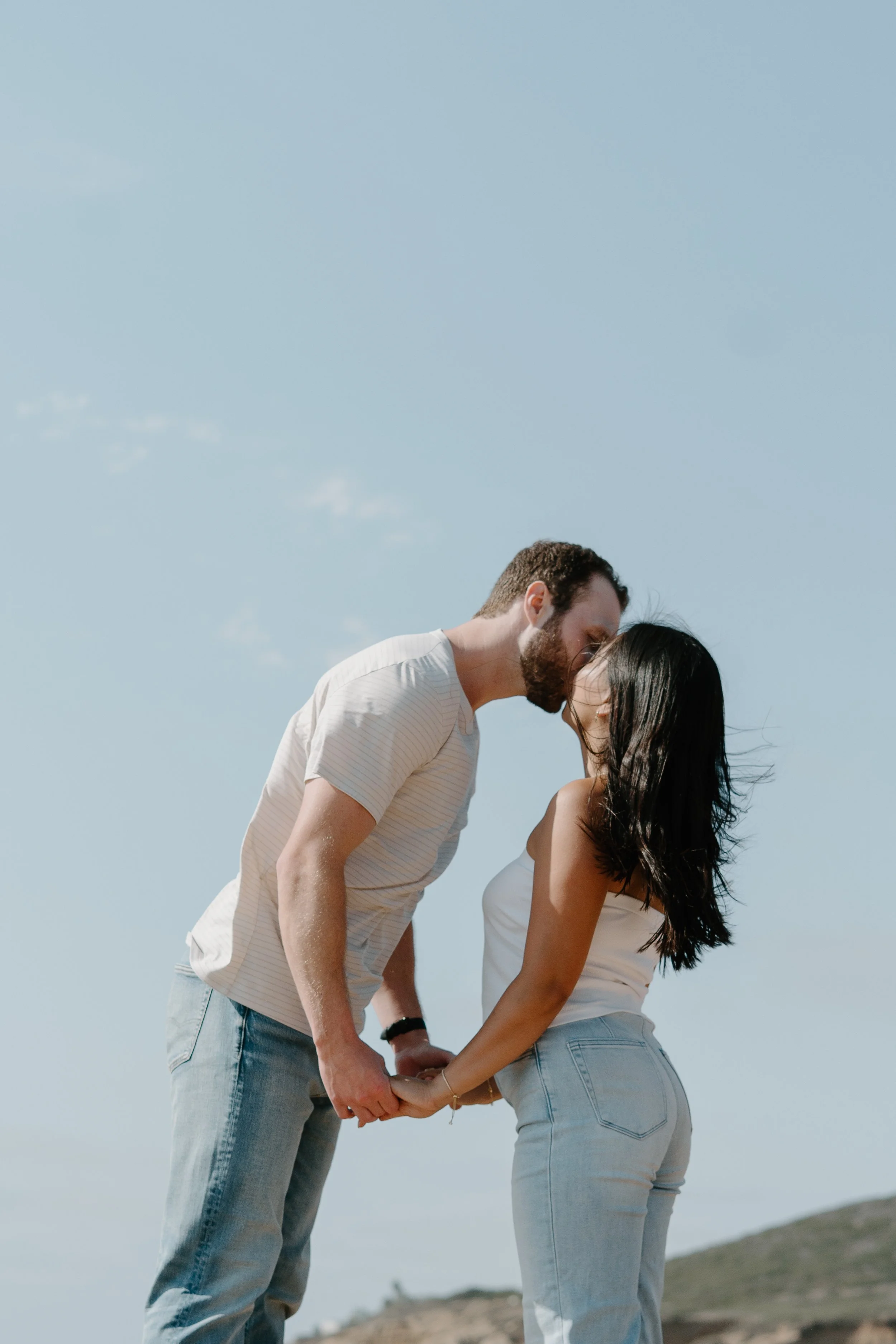 engaged-couple-kissing.jpg