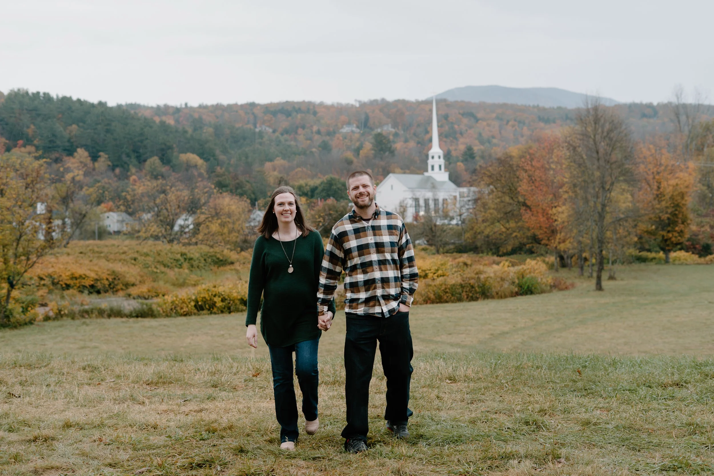 couple-walking-stowe-vermont-church.jpg