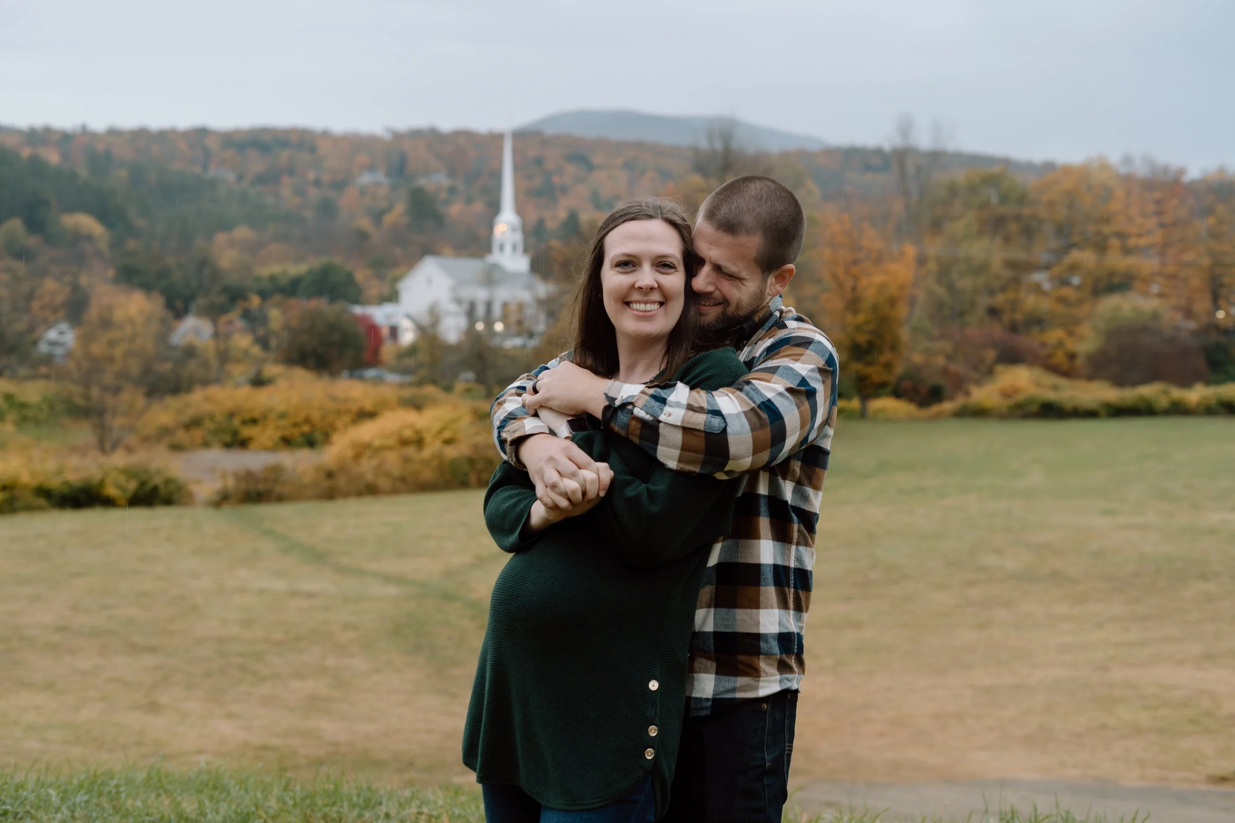couple-cuddled-stowe-church-vermont.jpg