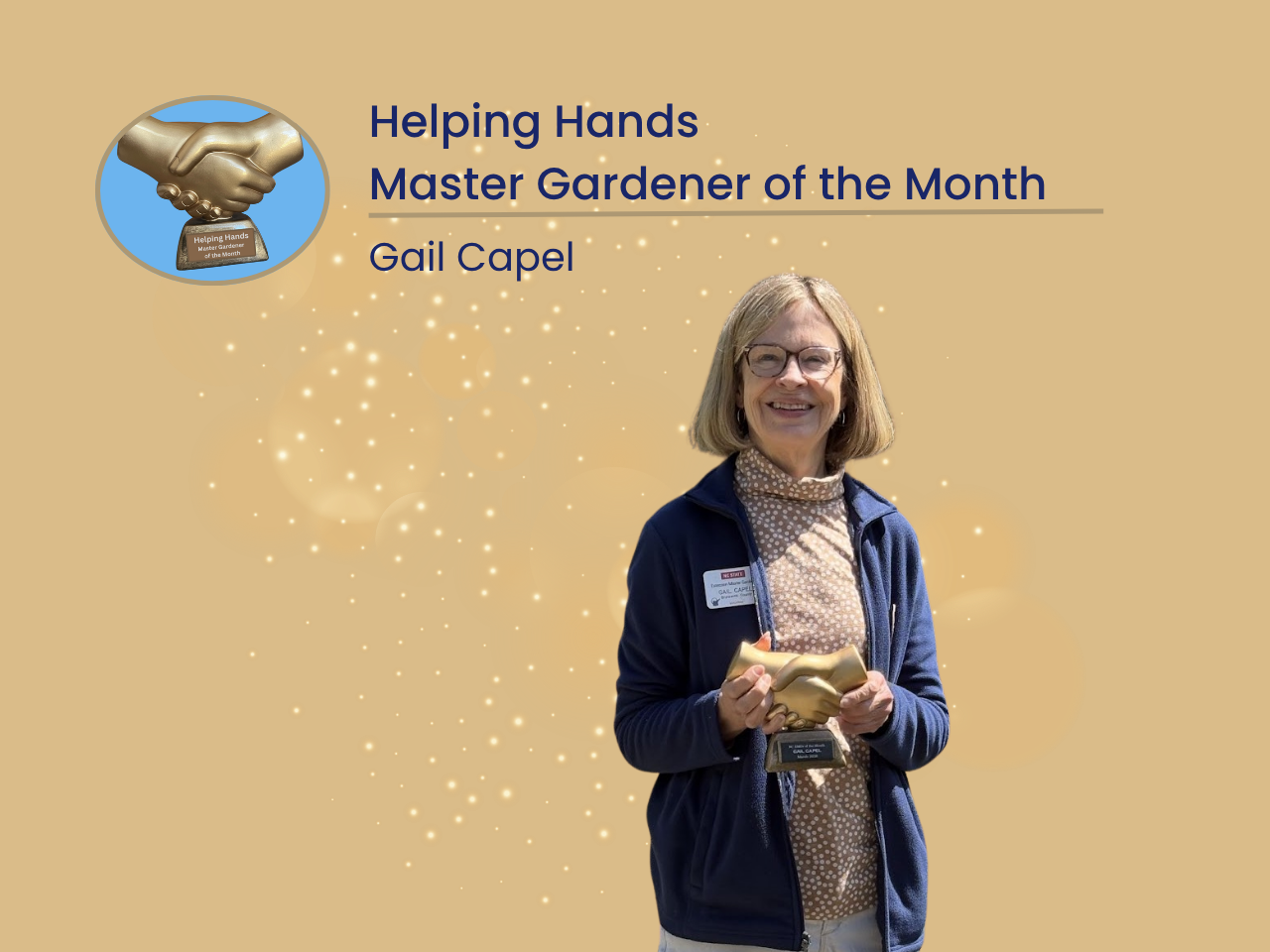Picture of Gail holding the Helping Hands award with a beautiful smile.