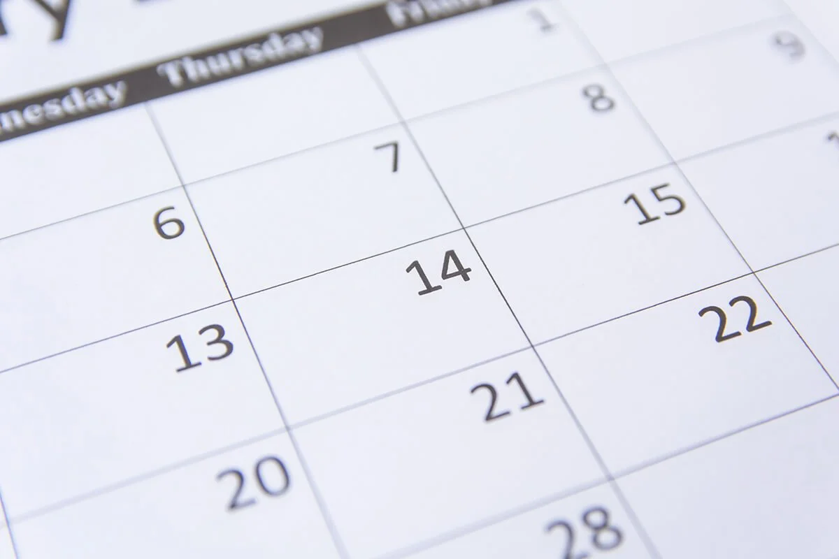 Close-up of a calendar showing dates from the 6th to the 28th, with days labeled as Thursday, Friday, Saturday, and Sunday.