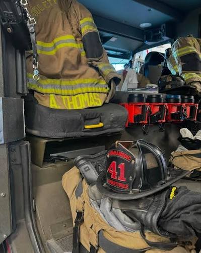 Nashville Fire Department paramedic gear and helmet marked "Aadm Thomas," representing the Tennessee whistleblower retaliation case Adam Thomas v. Metropolitan Government of Nashville and Davidson County. Employment law victory by Adam Rodrigues Law