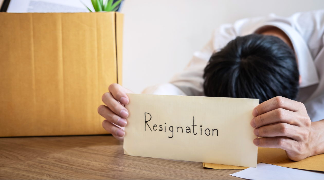 Employee holding a resignation notice after a forced resignation, illustrating constructive discharge and whistleblower retaliation under Tennessee employment law.