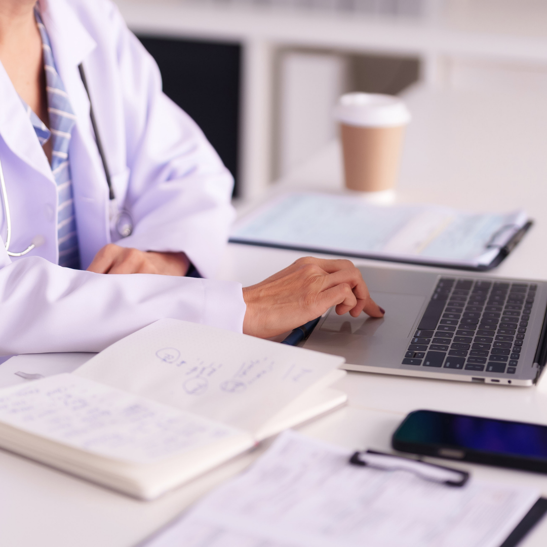 Functional medicine practitioner reviewing patient health data and advanced lab testing results